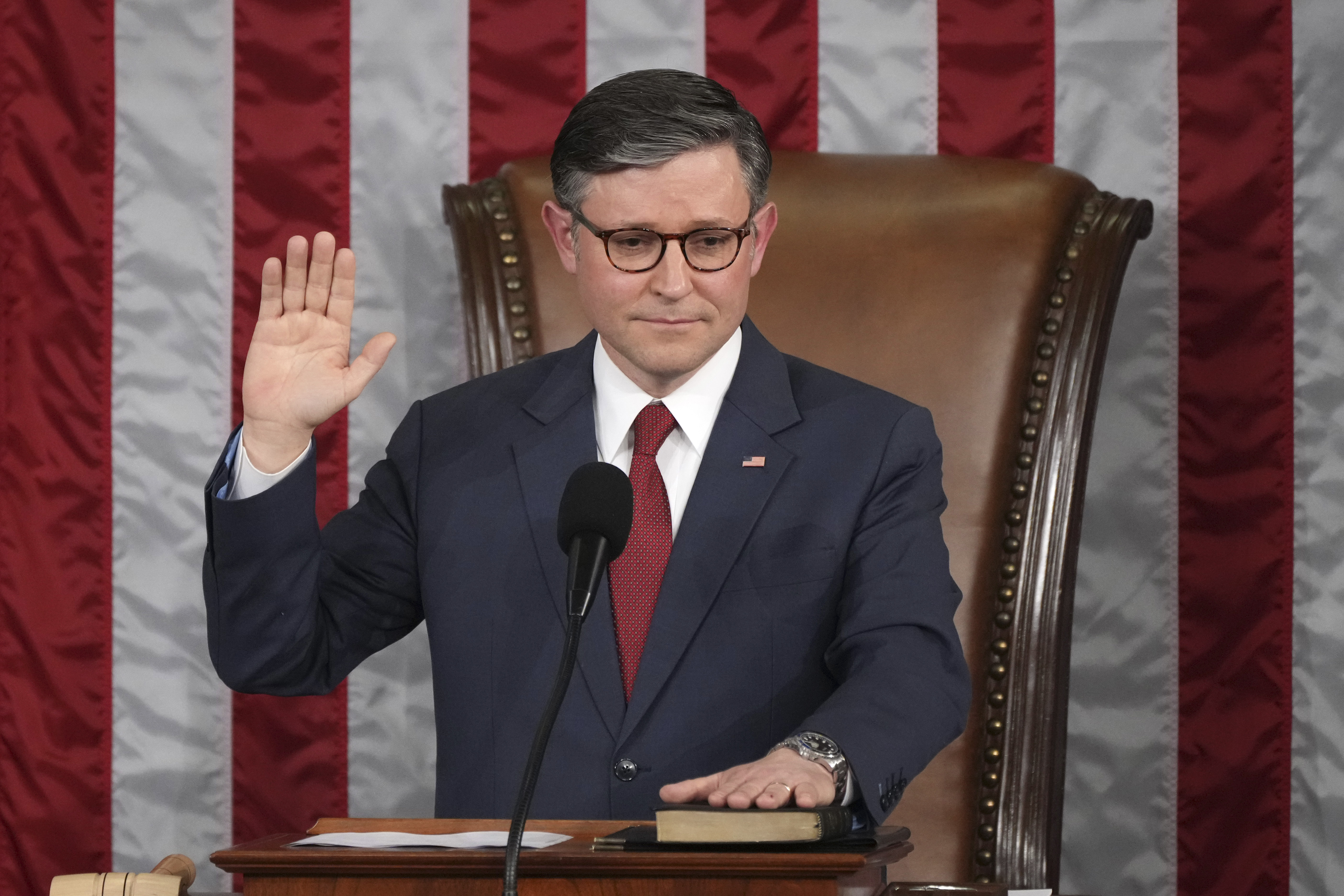 House Speaker Mike Johnson, R-La., takes the oath of office after being re-elected as the House of Representatives meets to elect a speaker and convene the new 119th Congress at the Capitol in Washington, Friday, Jan. 3, 2025. (AP Photo/Jacquelyn Martin)