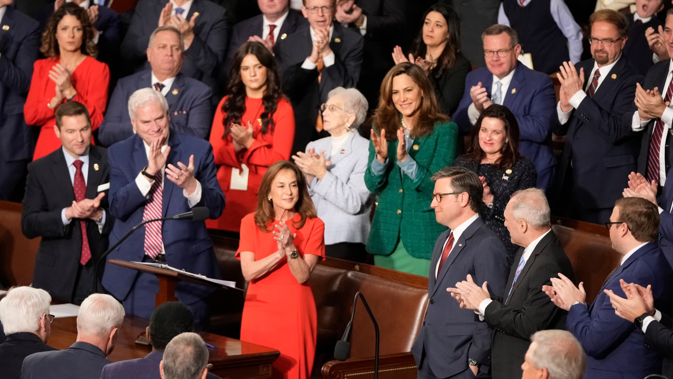 Rep. Lisa McClain, R-Mich., center left, and others applaud House Speaker Mike Johnson, R-La., as the House of Representatives meets to elect a speaker and convene the new 119th Congress at the Capitol in Washington, Friday, Jan. 3, 2025. (AP Photo/Mark Schiefelbein)