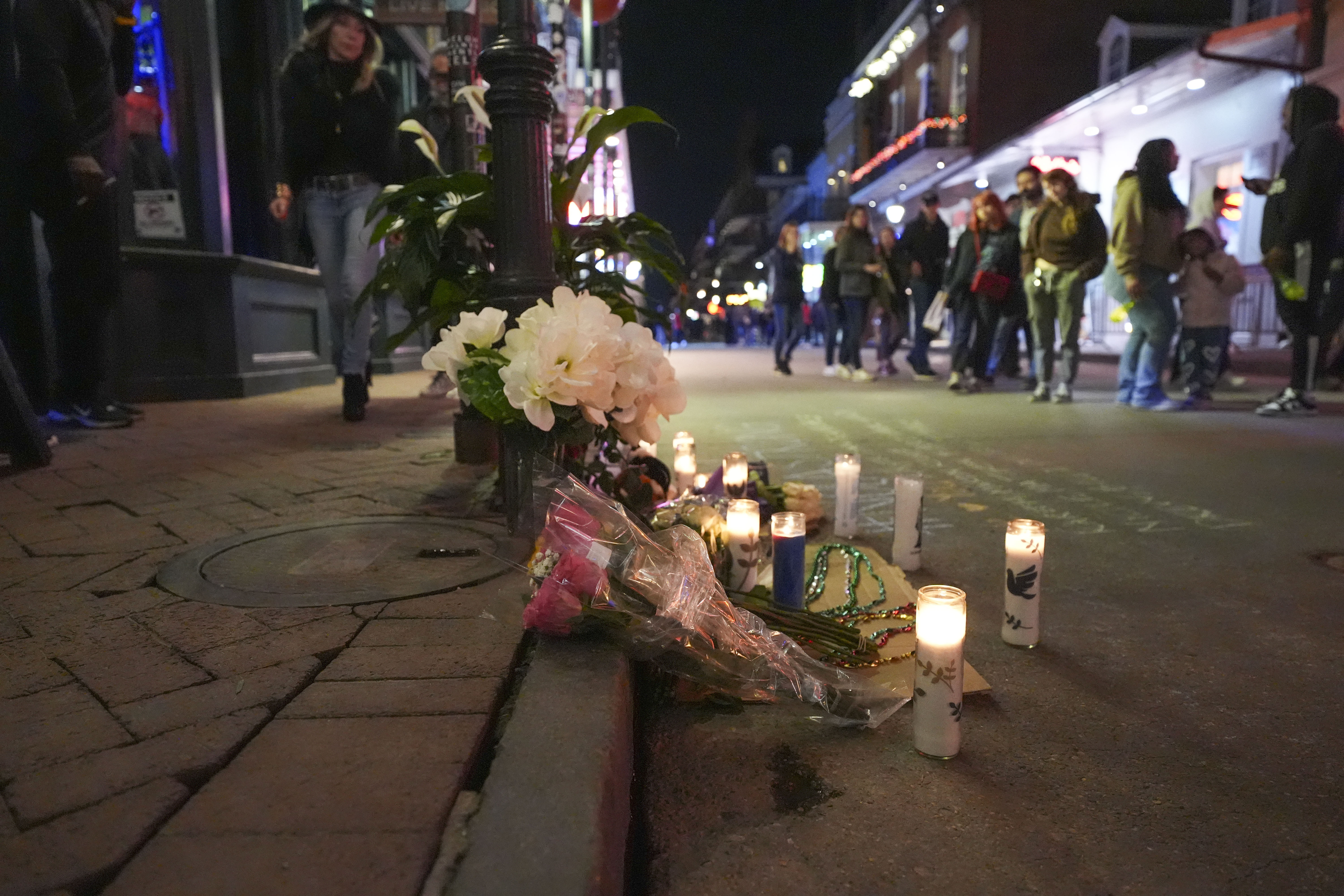 A memorial on Bourbon Street sits at the site of a deadly truck attack on New Year's Day in New Orleans, Friday, Jan. 3, 2025. (AP Photo/Gerald Herbert)