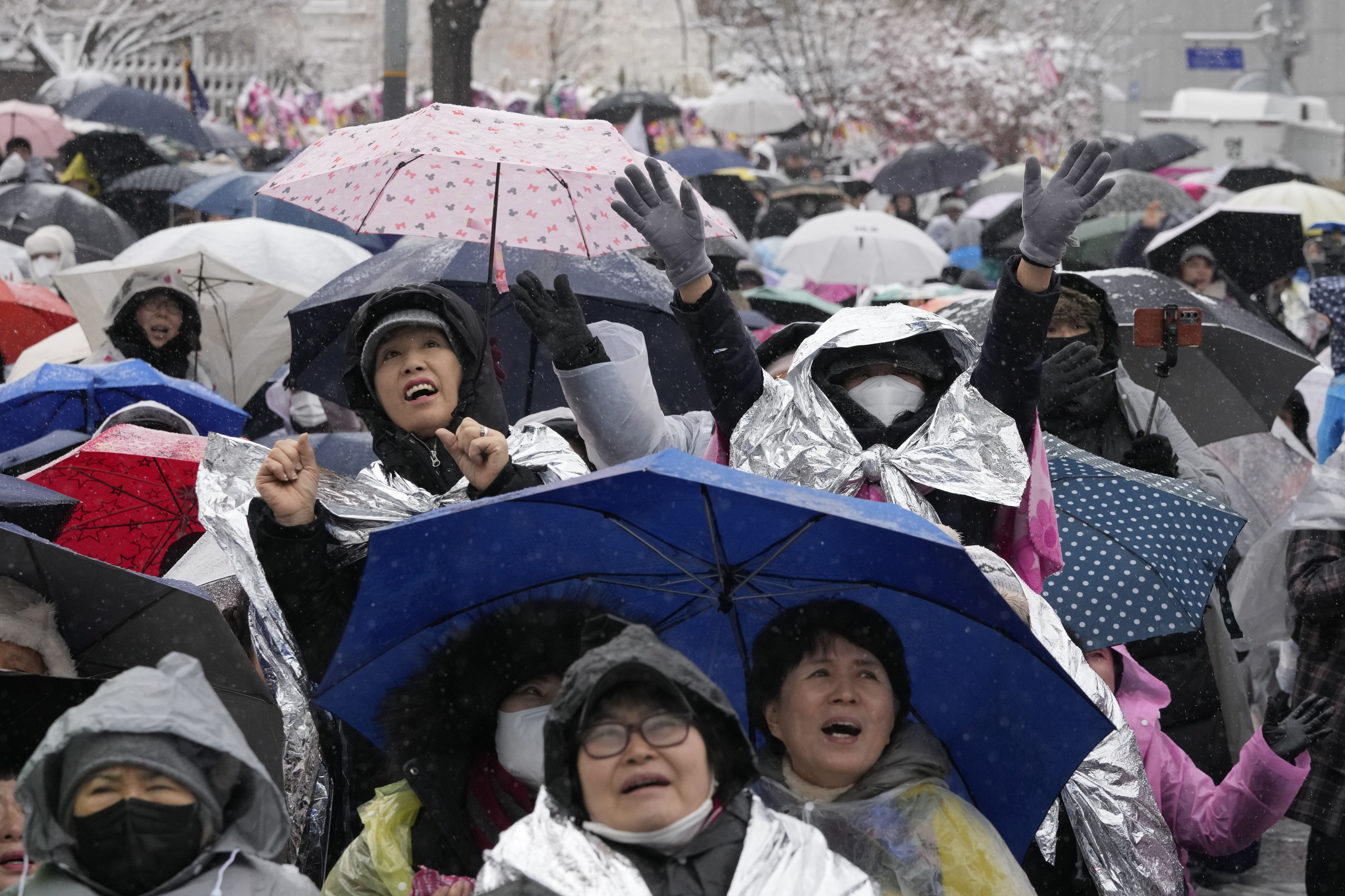 Supporters of impeached South Korean President Yoon Suk Yeol attend a Sunday service as they gather to oppose his impeachment near the presidential residence in Seoul, South Korea, Sunday, Jan. 5, 2025. (AP Photo/Ahn Young-joon)