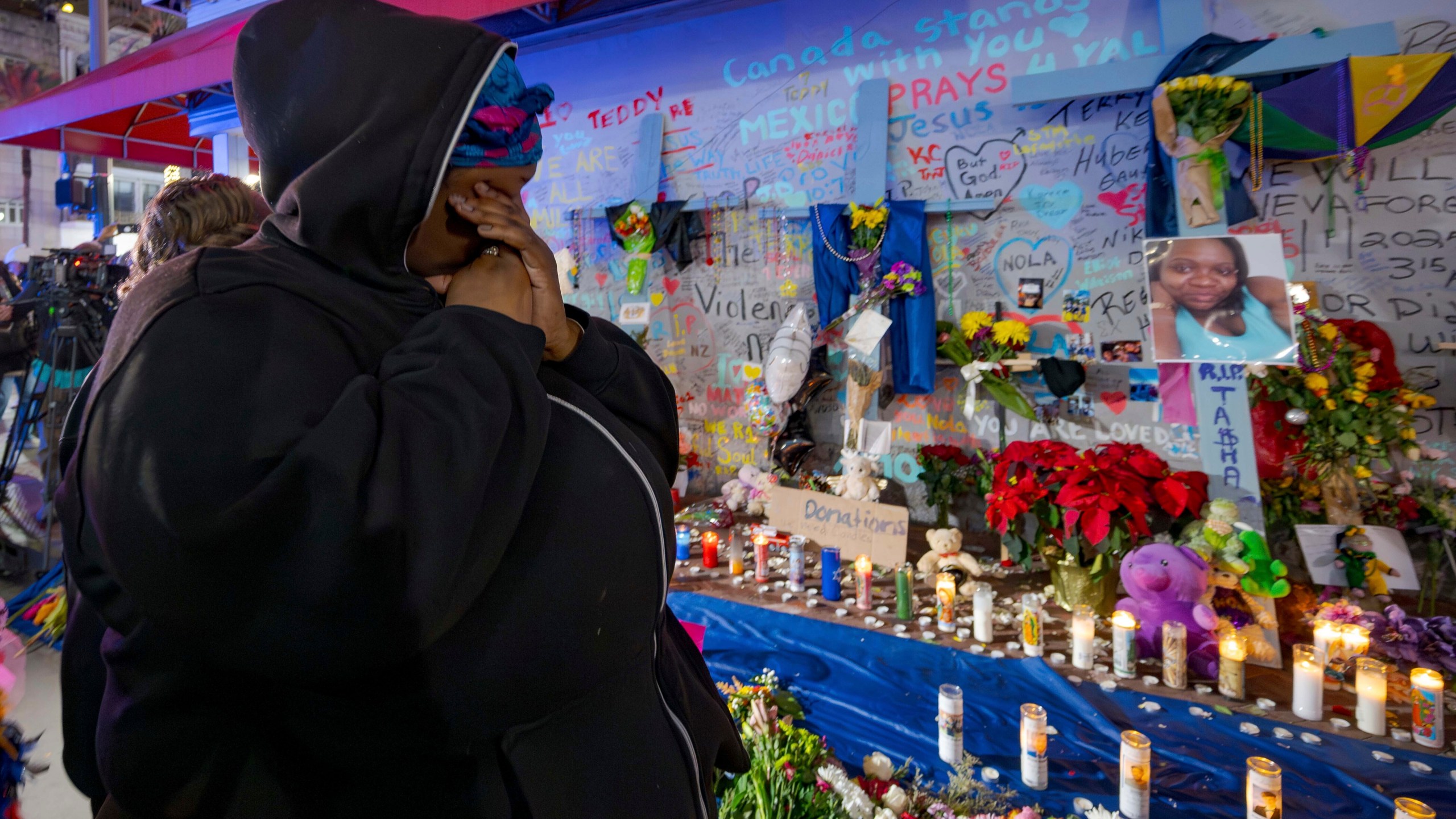 CORRECTS NAME TO LATASHA NOT TASHA Courtney Polk, cousin of LaTasha Polk, who was killed in the New Year's Day attack, reacts at a memorial on Bourbon Street and Canal Street in New Orleans, Saturday, Jan. 4, 2025, (AP Photo/Matthew Hinton)