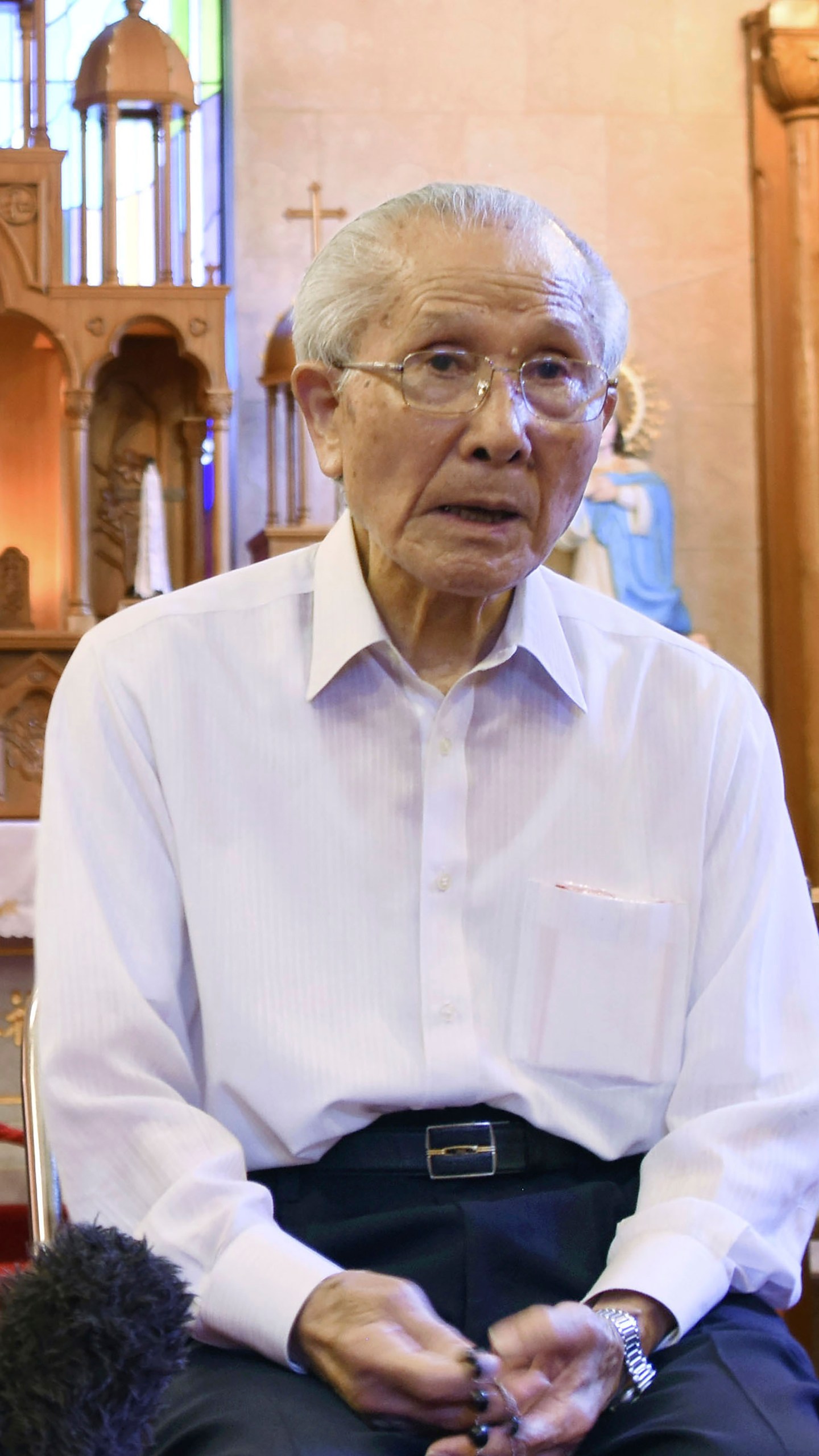 FILE - Shigemi Fukahori is interviewed at the Urakami Cathedral in Nagasaki, southern Japan, on July 29, 2020. Shigemi Fukahori, a survivor of the 1945 Nagasaki atomic bombing, who devoted his life to praying for peace and the souls of the victims, has died. He was 93. (Kyodo News via AP, File)