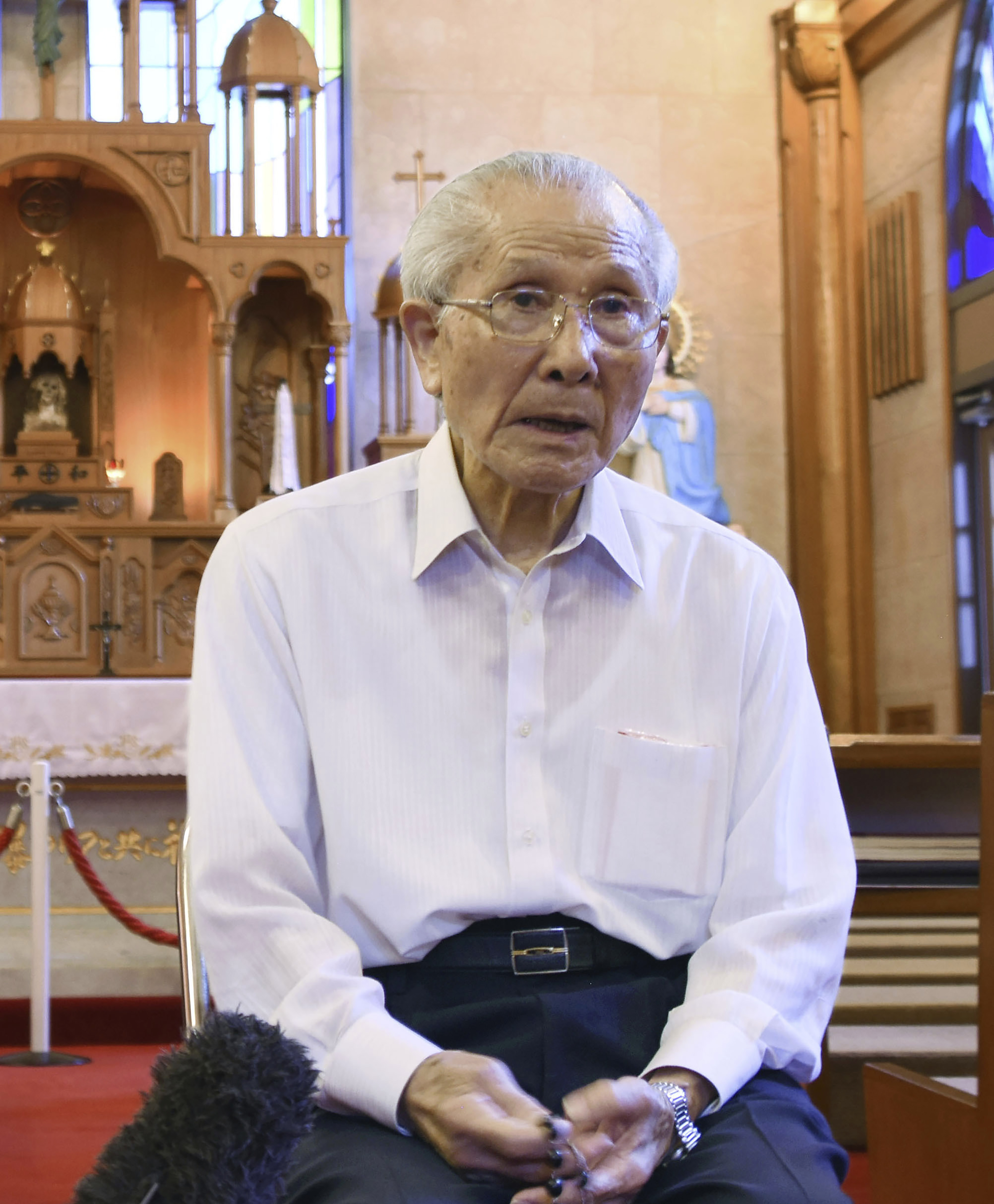 FILE - Shigemi Fukahori is interviewed at the Urakami Cathedral in Nagasaki, southern Japan, on July 29, 2020. Shigemi Fukahori, a survivor of the 1945 Nagasaki atomic bombing, who devoted his life to praying for peace and the souls of the victims, has died. He was 93. (Kyodo News via AP, File)