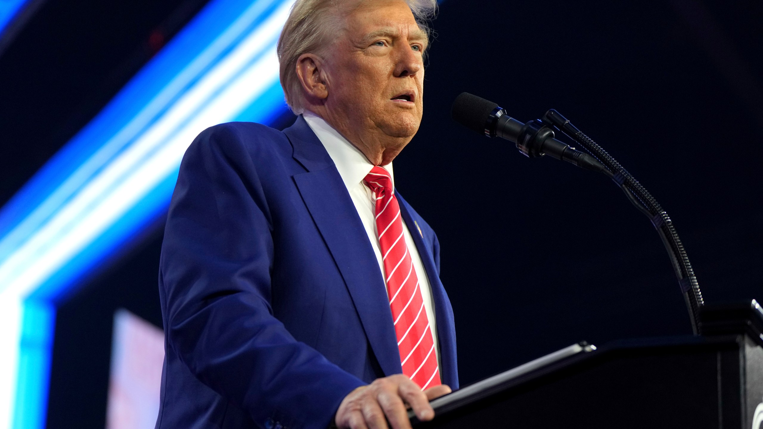 President-elect Donald Trump speaks at AmericaFest, Sunday, Dec. 22, 2024, in Phoenix. (AP Photo/Rick Scuteri)