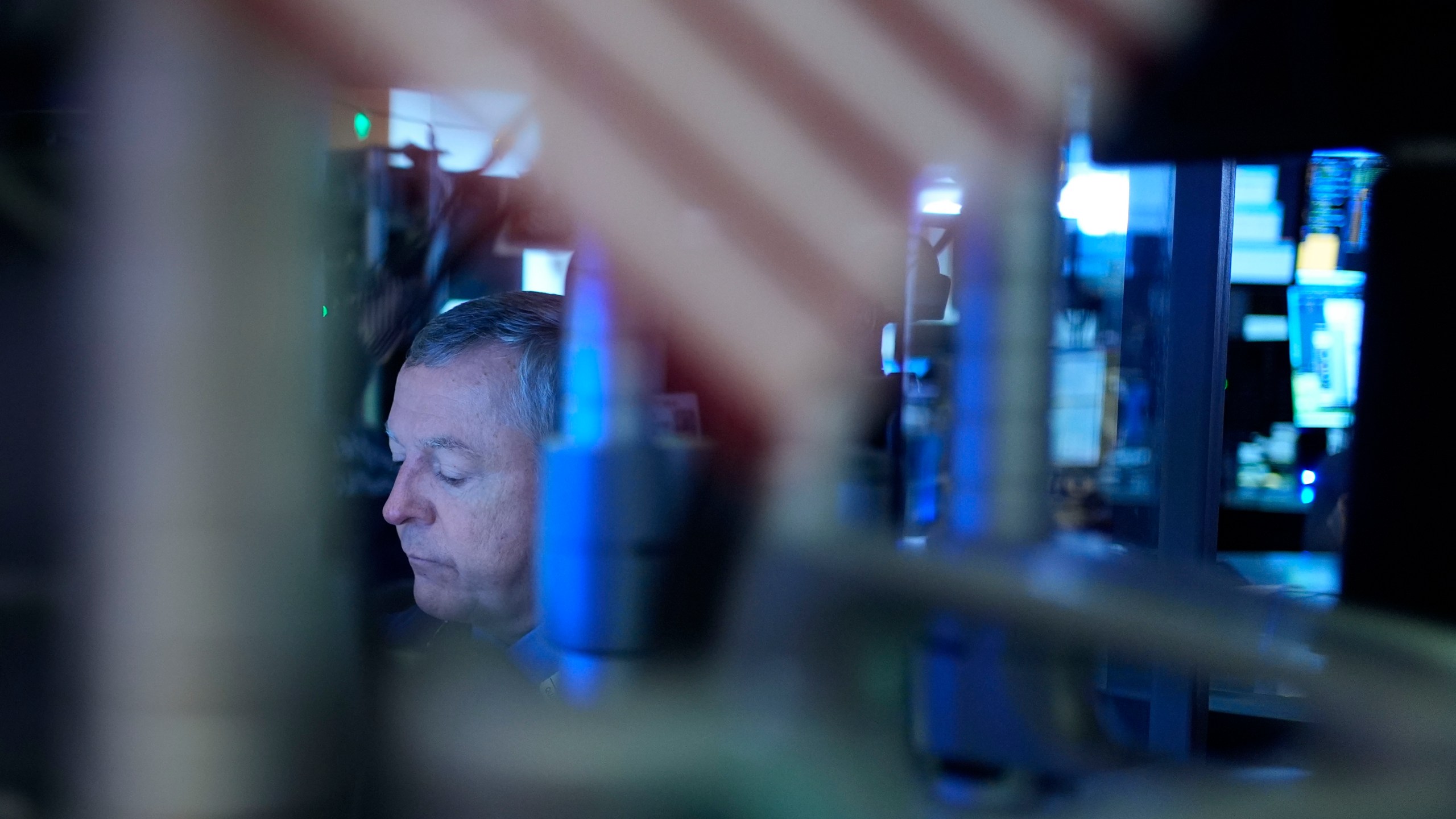 A trader works on the floor at the New York Stock Exchange in New York's Financial District Thursday, Jan. 2, 2025. (AP Photo/Seth Wenig)