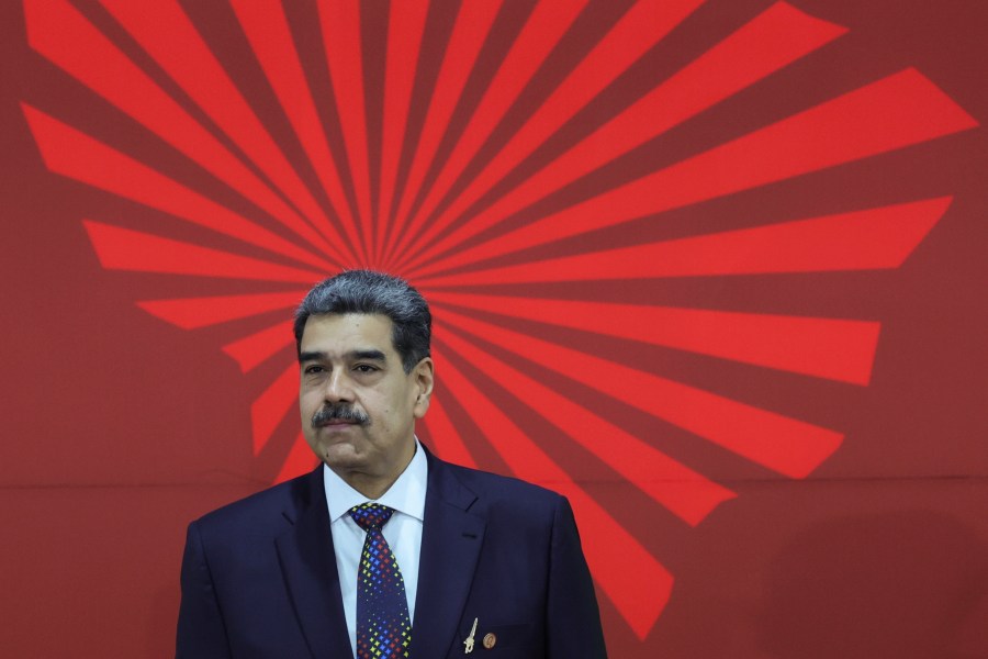 FILE - Venezuelan President Nicolas Maduro waits to receive attendees at the start of the Bolivarian Alliance for the Peoples of Our America (ALBA) Summit in Caracas, Venezuela, Dec. 14, 2024. (AP Photo/Jesus Vargas, File)