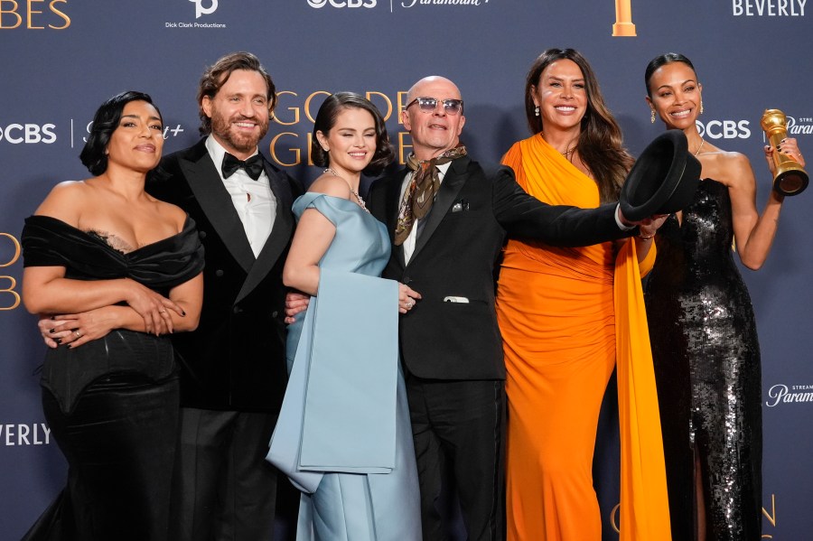 Adriana Paz, from left, Edgar Ramirez, Selena Gomez, Jacques Audiard, Karla Sofia Gascon, and Zoe Saldana pose in the press room with the award for best motion picture - musical or comedy for "Emilia Perez" during the 82nd Golden Globes on Sunday, Jan. 5, 2025, at the Beverly Hilton in Beverly Hills, Calif. (AP Photo/Chris Pizzello)