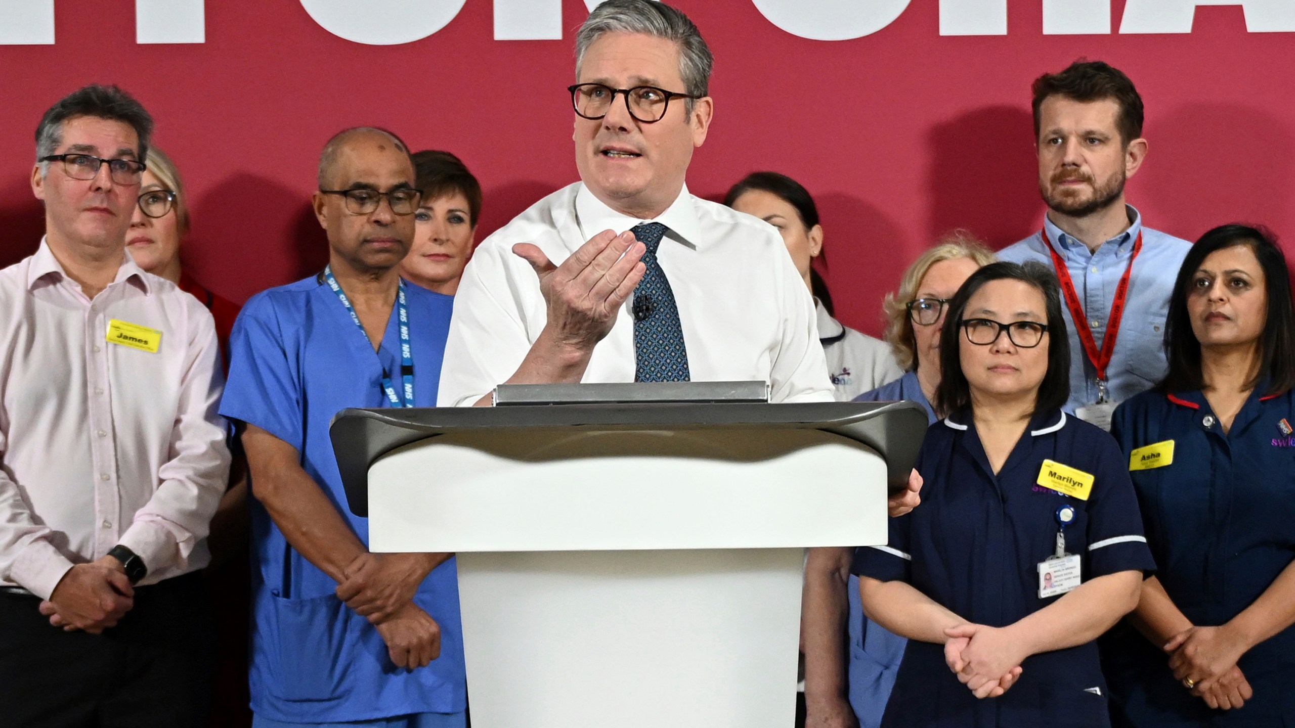 Britain's Prime Minister Keir Starmer gives a speech on reducing NHS wait times as he visits a healthcare provider in Surrey, England, Monday, Jan. 6, 2025, (Leon Neal/Pool Photo via AP)