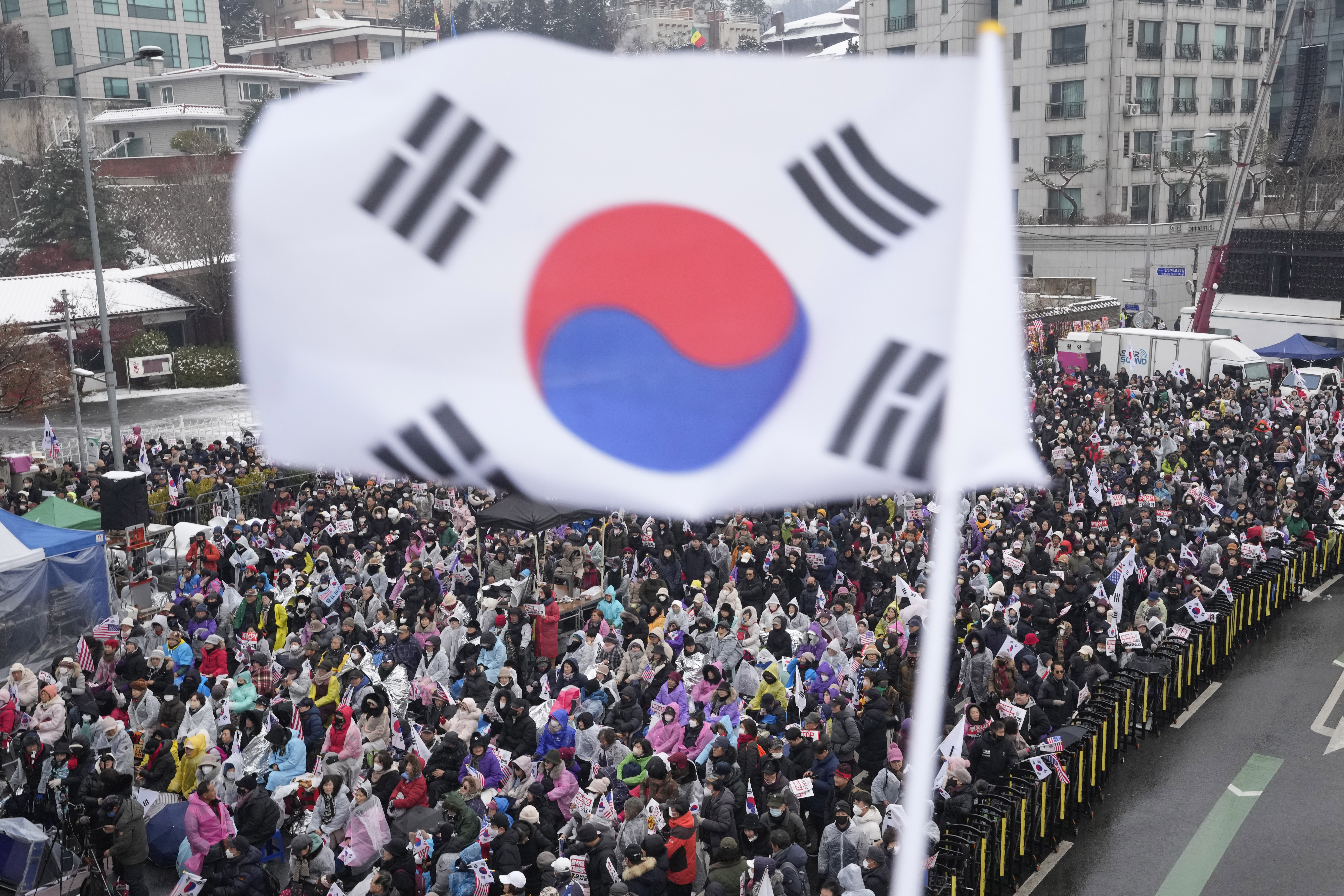 Supporters of impeached South Korean President Yoon Suk Yeol stage a rally to oppose his impeachment near the presidential residence in Seoul, South Korea, Sunday, Jan. 5, 2025. (AP Photo/Ahn Young-joon)