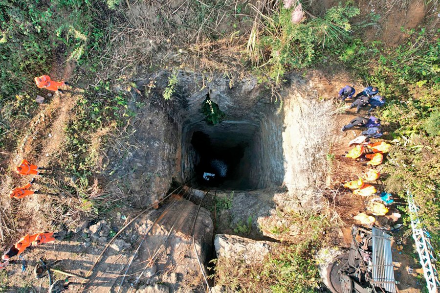 This image provided by Indian Army shows rescue workers standing around a coal mine where at least nine workers are trapped, in Umrangso area of Dimapur Hasao district in northeastern state of Assam, India, Tuesday, Jan. 7, 2025. (Indian Army via AP)