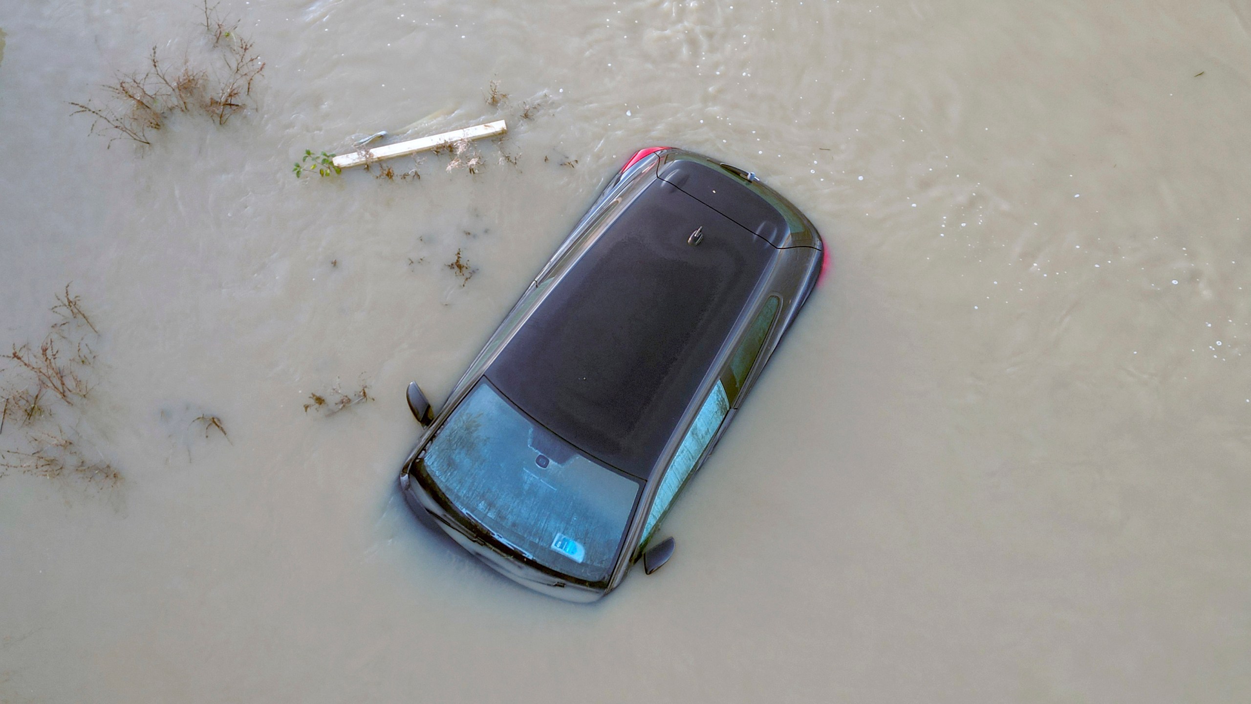 A car sits in the floods of the river Soar in Barrow Upon Soar, England, Tuesday, Jan. 7, 2025.(AP Photo/Darren Staples)