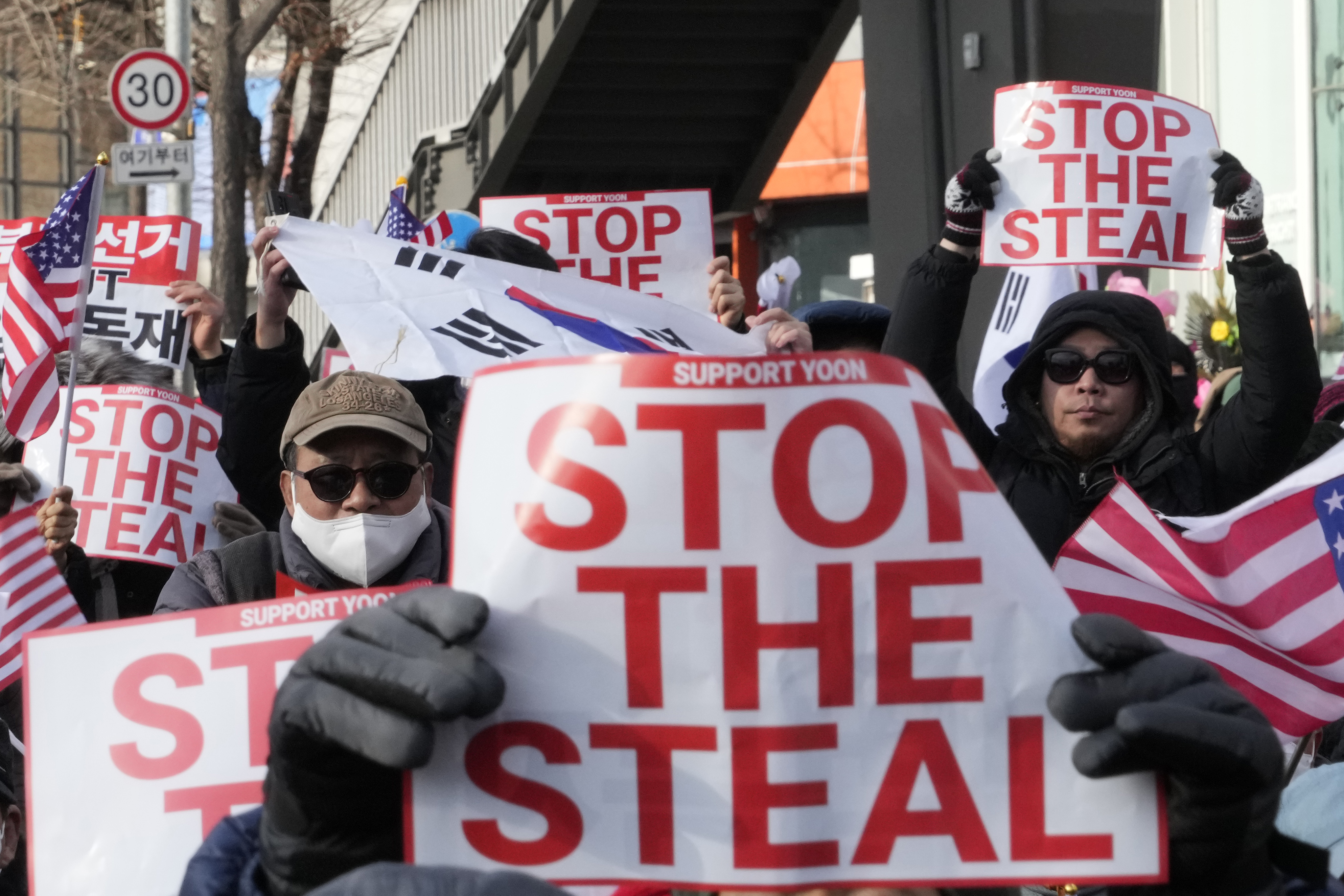 Supporters of impeached South Korean President Yoon Suk Yeol attend a rally to oppose his impeachment near the presidential residence in Seoul, South Korea, Tuesday, Jan. 7, 2025. (AP Photo/Ahn Young-joon)