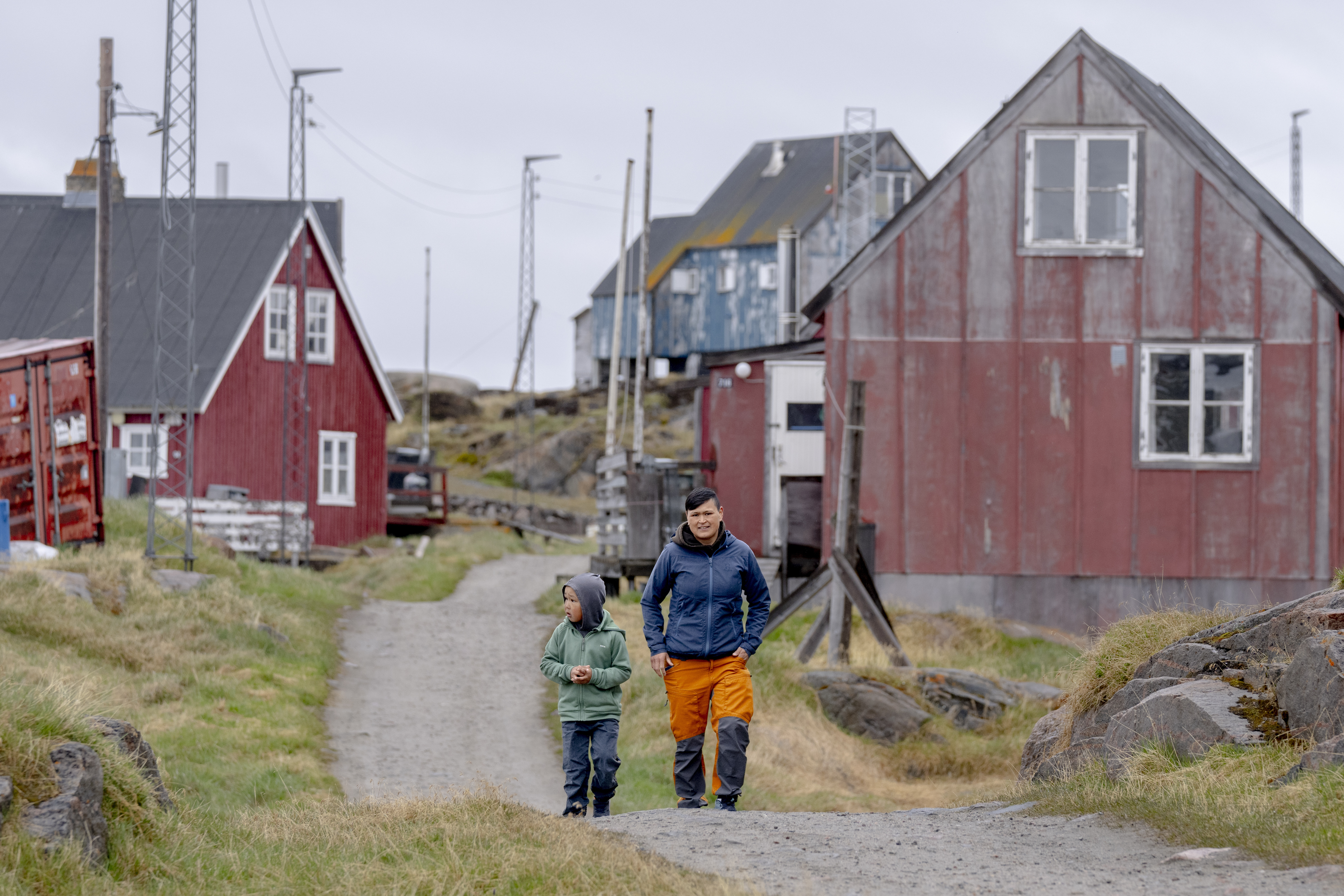 FILE - Local residents walk in the settlement Attu, in the Qeqertalik municipality, western Greenland, Monday, July 1, 2024. (Ida Marie Odgaard/Ritzau Scanpix via AP, File)