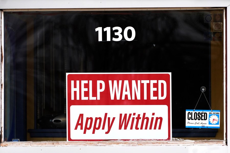 FILE - A "help wanted" sign is seen at an Allstate insurance office in Elgin, Ill., March 19, 2022. (AP Photo/Nam Y. Huh, File)