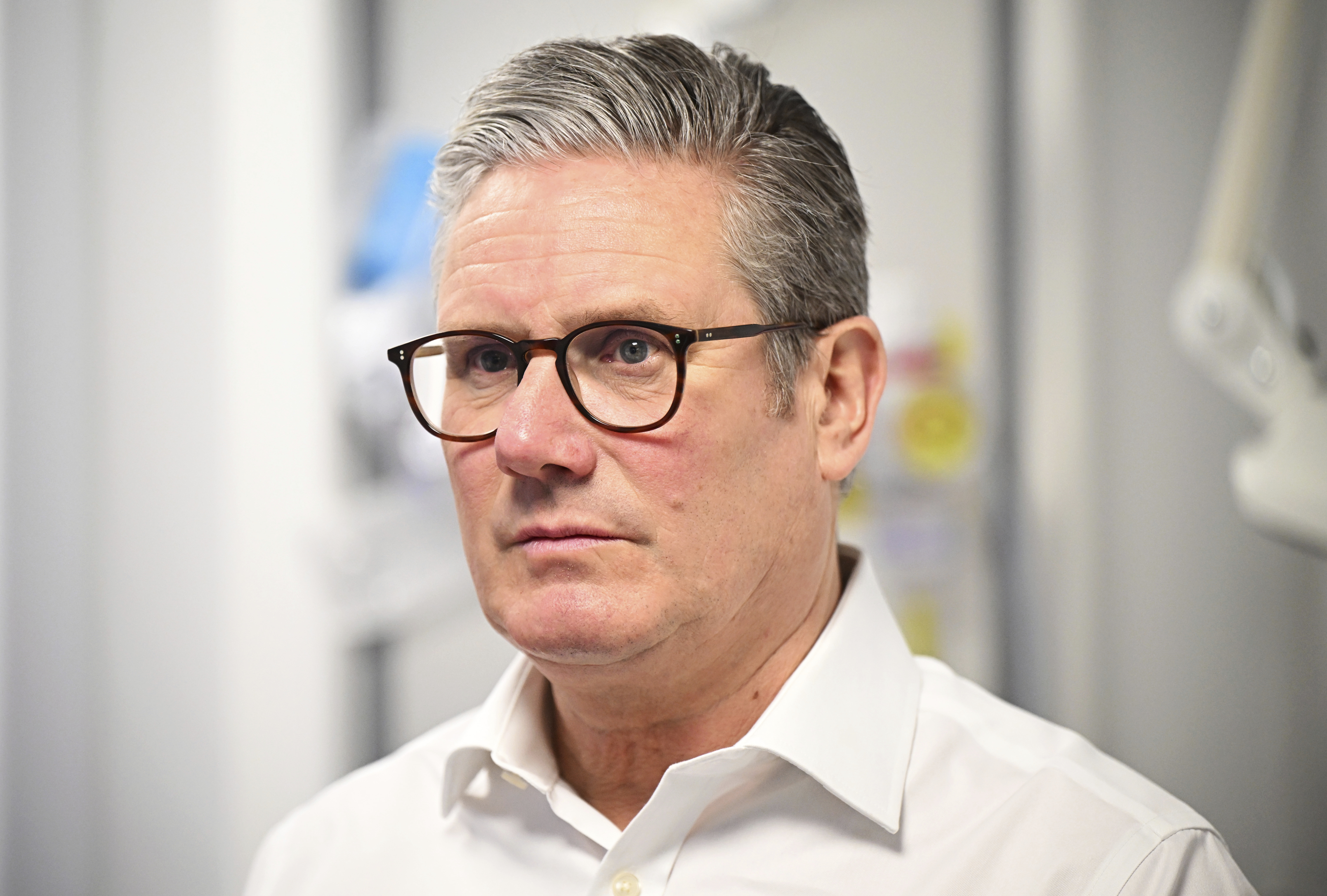 Britain's Prime Minister Keir Starmer visits a healthcare provider to deliver remarks on reducing NHS wait times, in Surrey, England, Monday, Jan. 6, 2025, (Leon Neal/Pool Photo via AP)