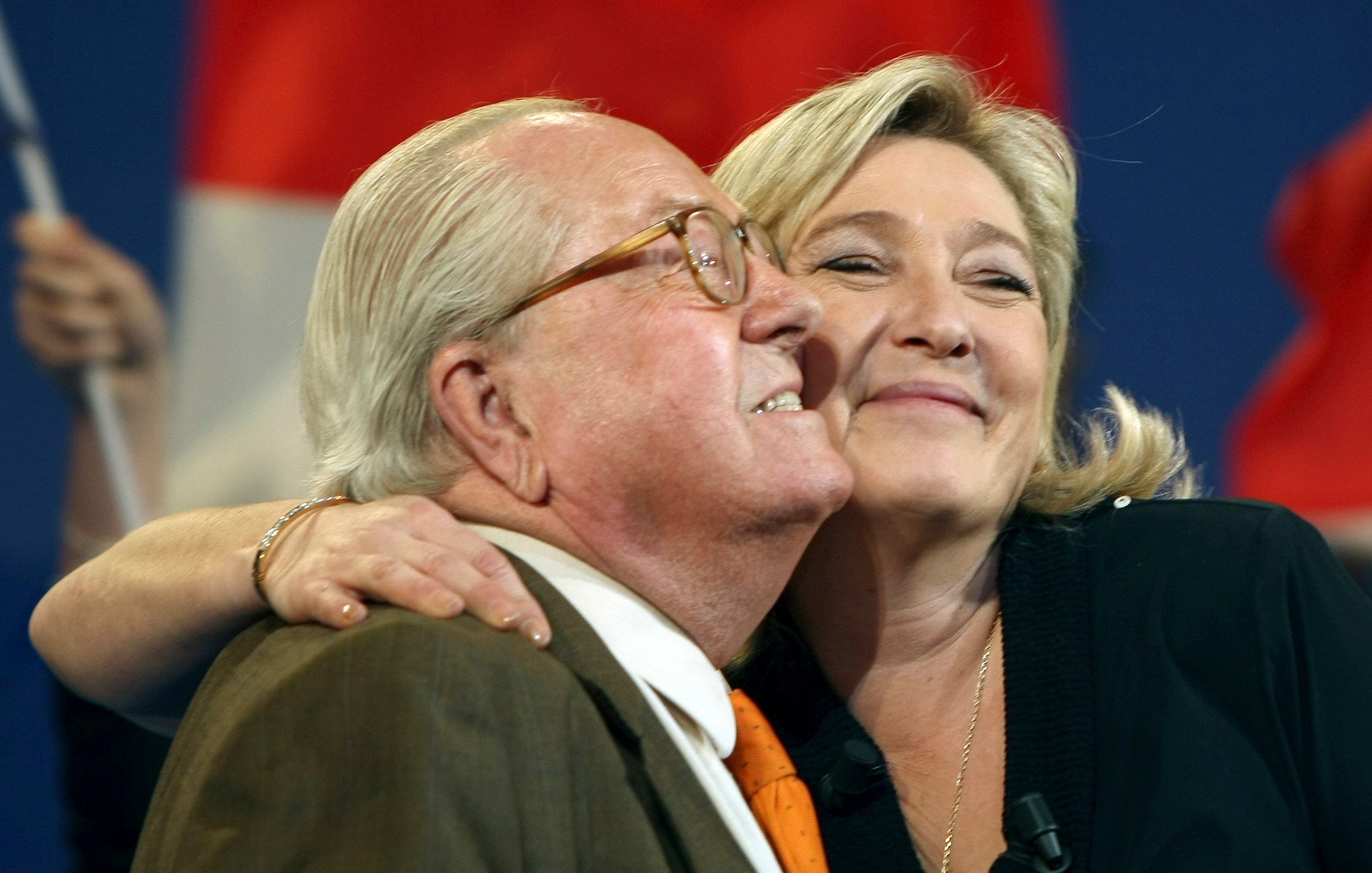 FILE- Honorary President of far-right party National Front Jean-Marie Le Pen, left, and his daughter French far-right leader and National Front Party candidate for the 2012 French presidential elections, Marine Le Pen, during a campaign meeting in Marseille, southern France, Sunday, March 4, 2012. (AP Photo/Claude Paris, File)