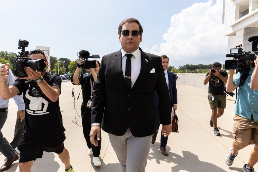 FILE - Former U.S. Rep. George Santos arrives at court in Central Islip, N.Y., Monday, Aug. 19, 2024. (AP Photo/Stefan Jeremiah, File)