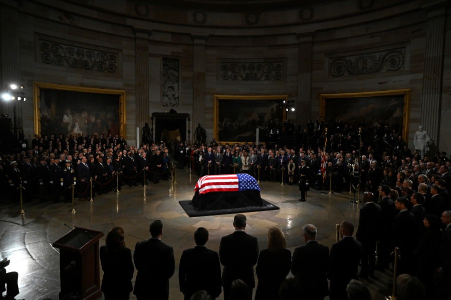 The flag-draped casket of former President Jimmy Carter lies in state during a ceremony in the Capitol, Tuesday, Jan. 7, 2025, in Washington. Carter died Dec. 29 at the age of 100. (Saul Loeb/Pool via AP)