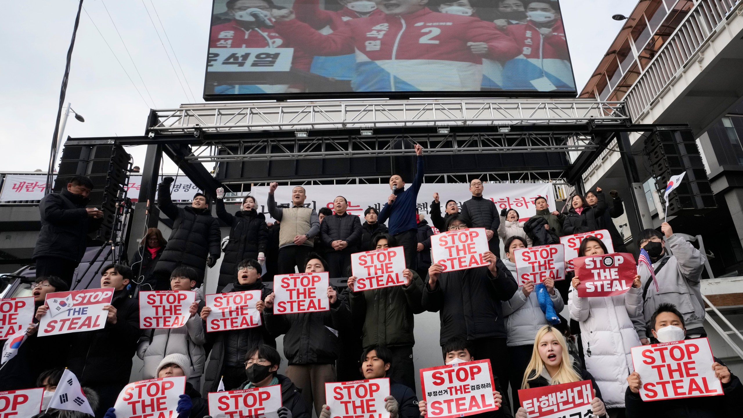 Supporters of impeached South Korean President Yoon Suk Yeol shout slogans during a rally to oppose his impeachment near the presidential residence in Seoul, South Korea, Wednesday, Jan. 8, 2025. (AP Photo/Ahn Young-joon)