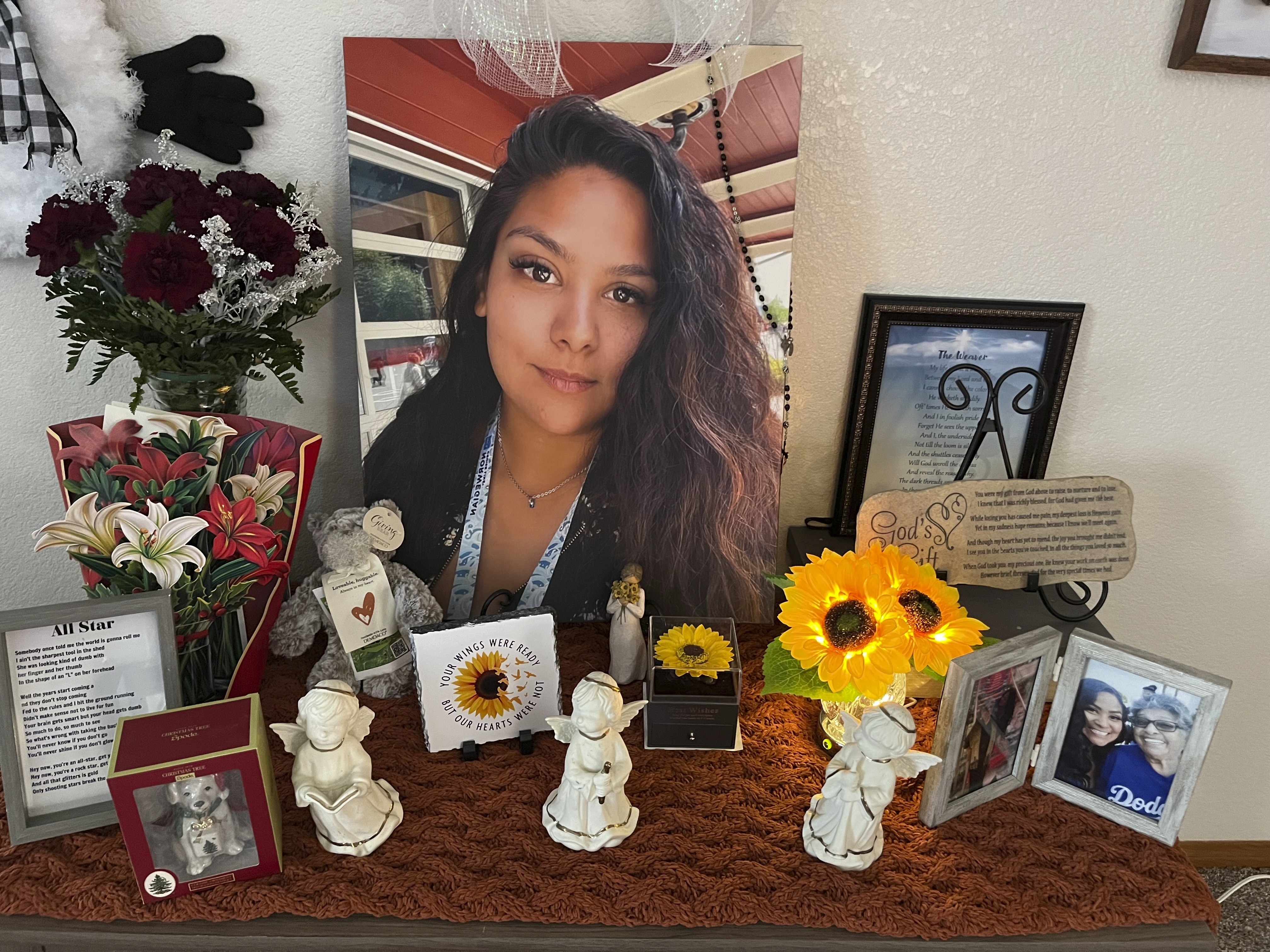 A photograph of Stephanie Cosme sits on an altar on Dec. 22, 2023, in Palmdale, Calif. (Paula Zamorano via AP)