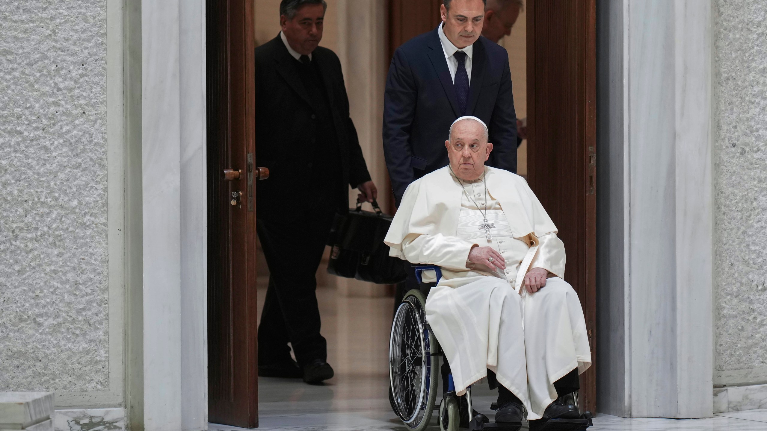 Pope Francis arrives for his weekly general audience in the Paul VI Hall, at the Vatican, Wednesday, Jan. 8, 2025. (AP Photo/Alessandra Tarantino)