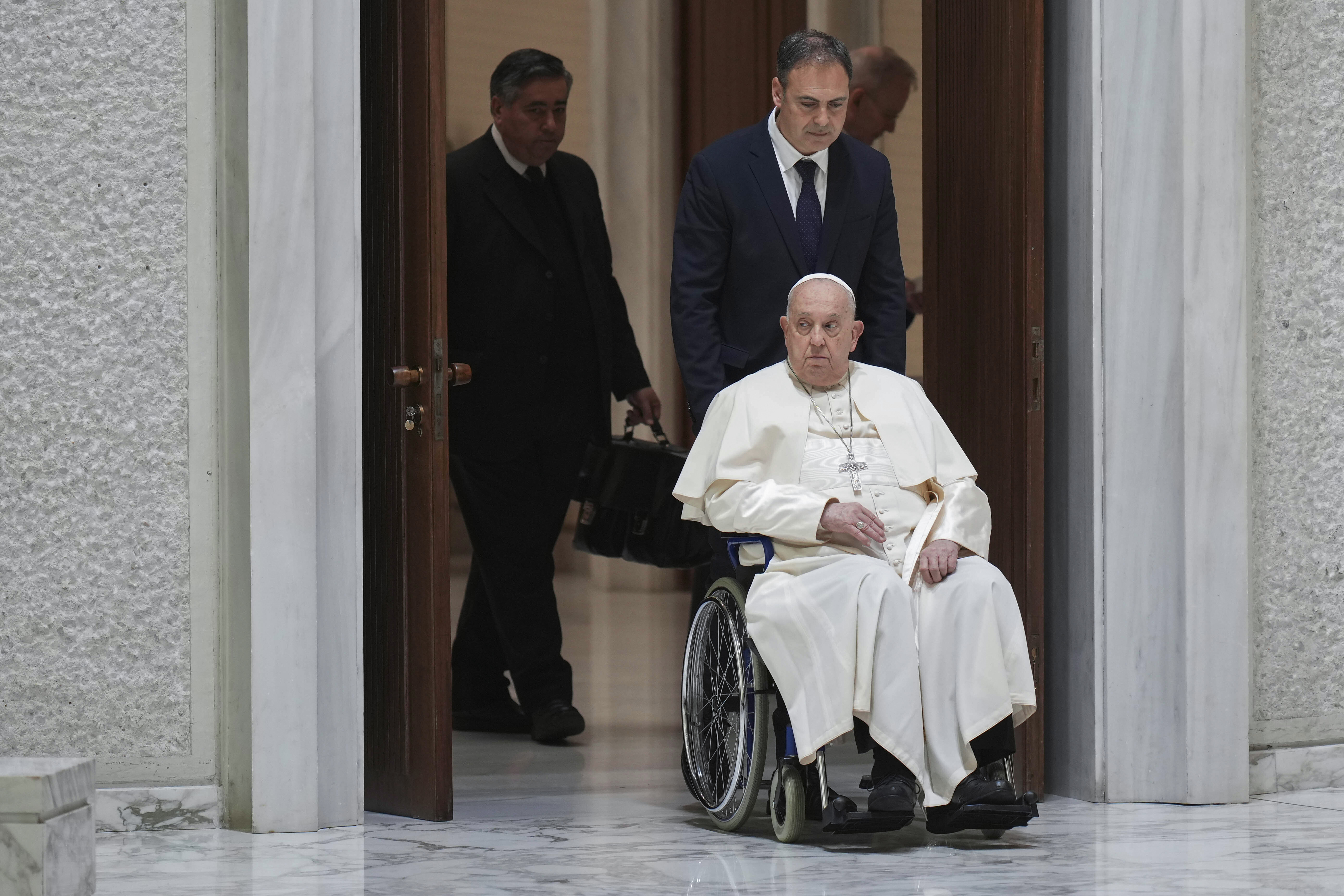 Pope Francis arrives for his weekly general audience in the Paul VI Hall, at the Vatican, Wednesday, Jan. 8, 2025. (AP Photo/Alessandra Tarantino)