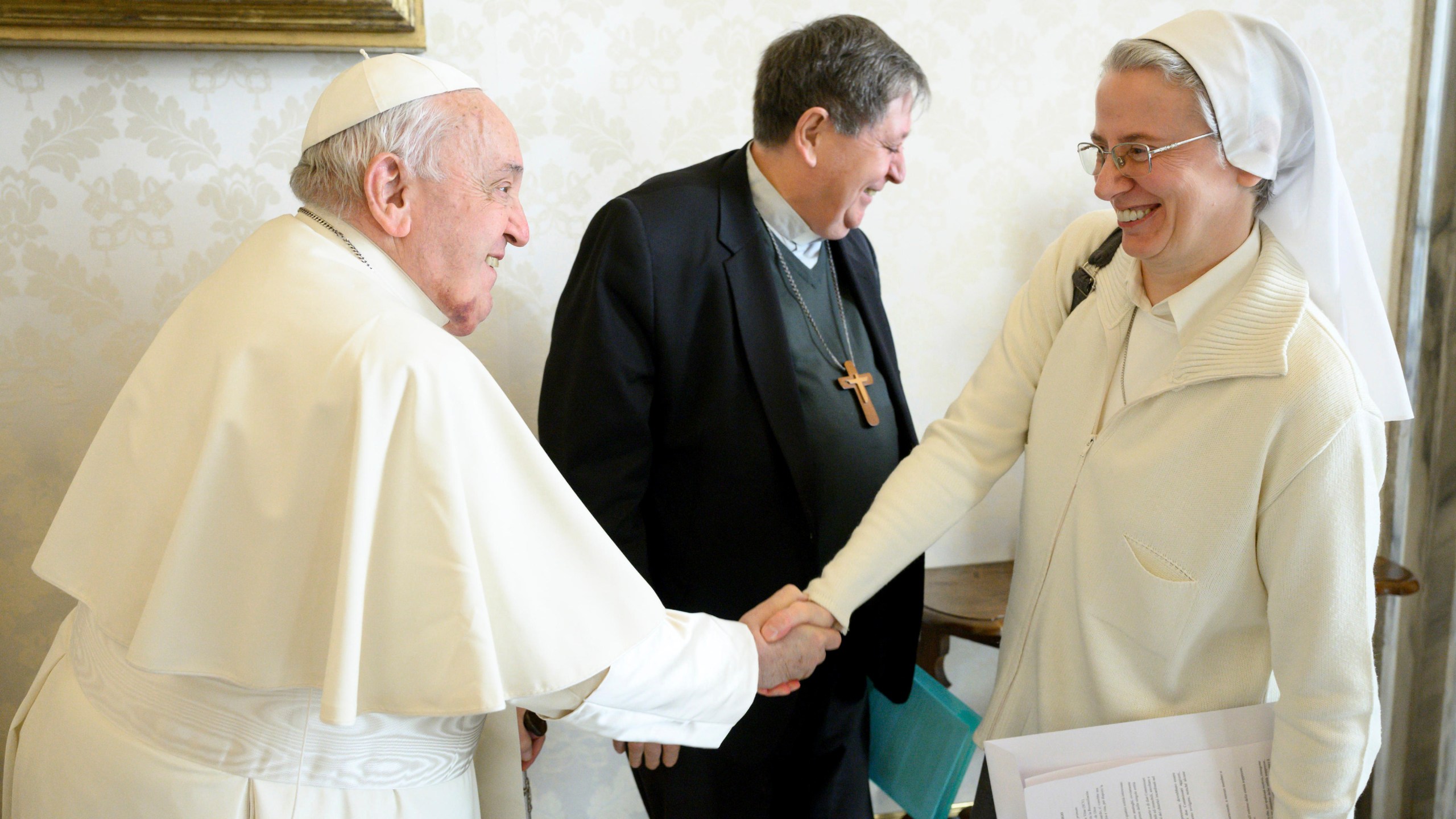 This image released on Wednesday Jan. 8, 2025 by the Vatican Media shows Pope Francis shaking hands with Sister Simona Brambilla, an Italian nun who is the first woman named to head a major Vatican office, the department responsible for all the church's religious orders, at the Vatican. (Vatican Media via AP)