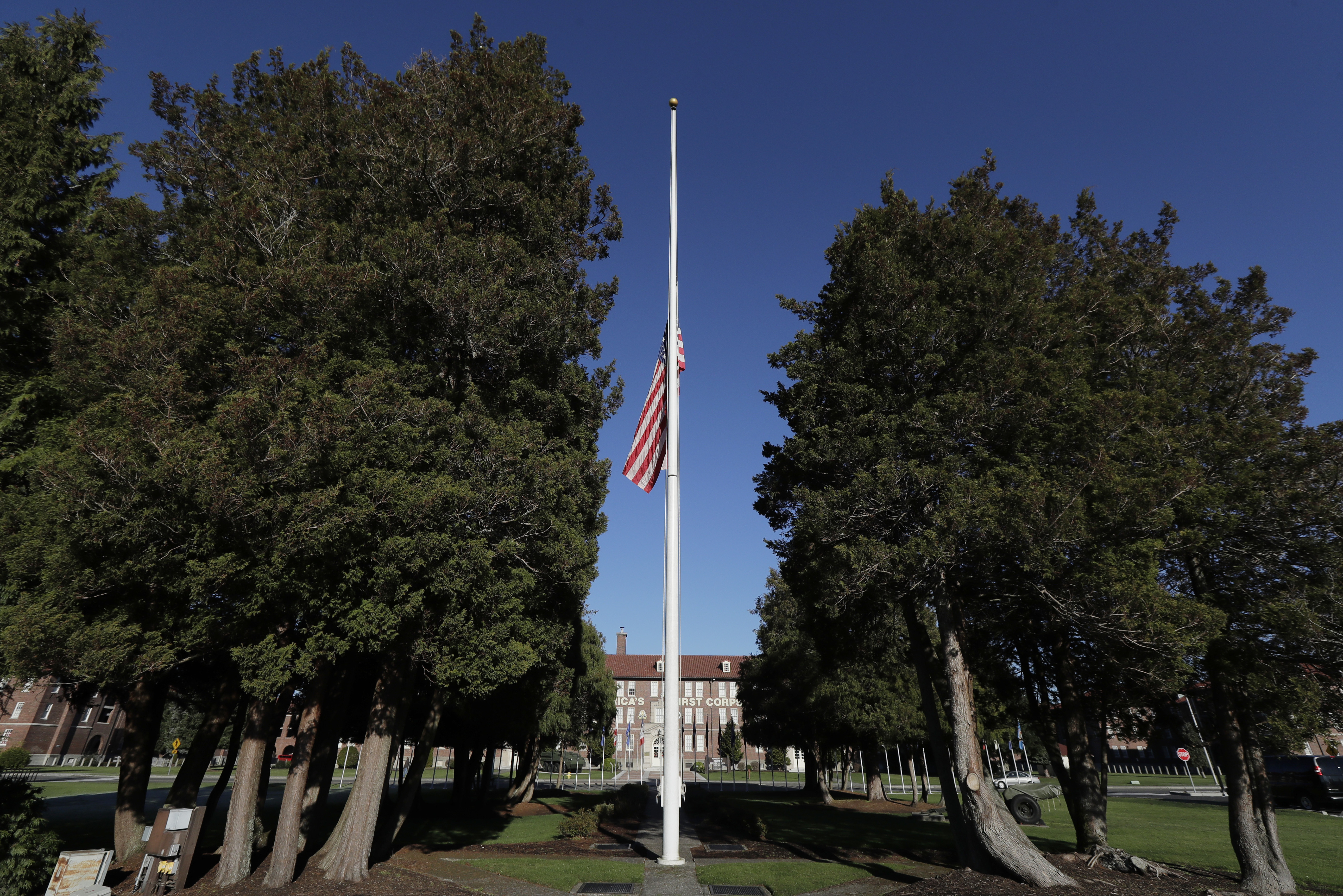 FILE - The main flag pole in front of the U.S. Army I Corps headquarters on Joint Base Lewis-McChord, south of Tacoma, Wash., hangs at half-staff, Wednesday, Dec. 5, 2018. (AP Photo/Ted S. Warren, File)