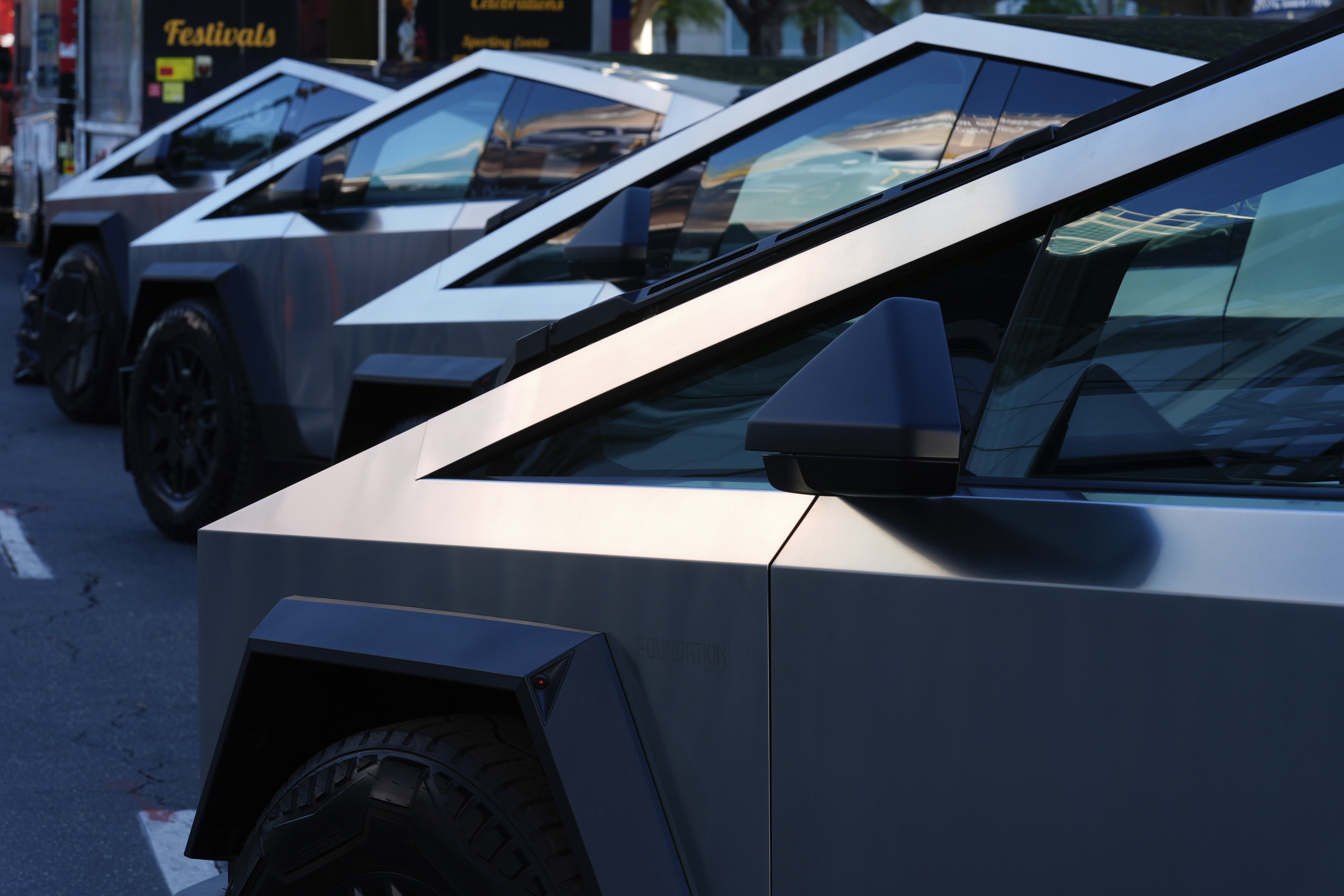 FILE - Tesla Cybertrucks are displayed at the AutoMobility LA Auto Show, Nov. 21, 2024, in Los Angeles. (AP Photo/Damian Dovarganes, File)