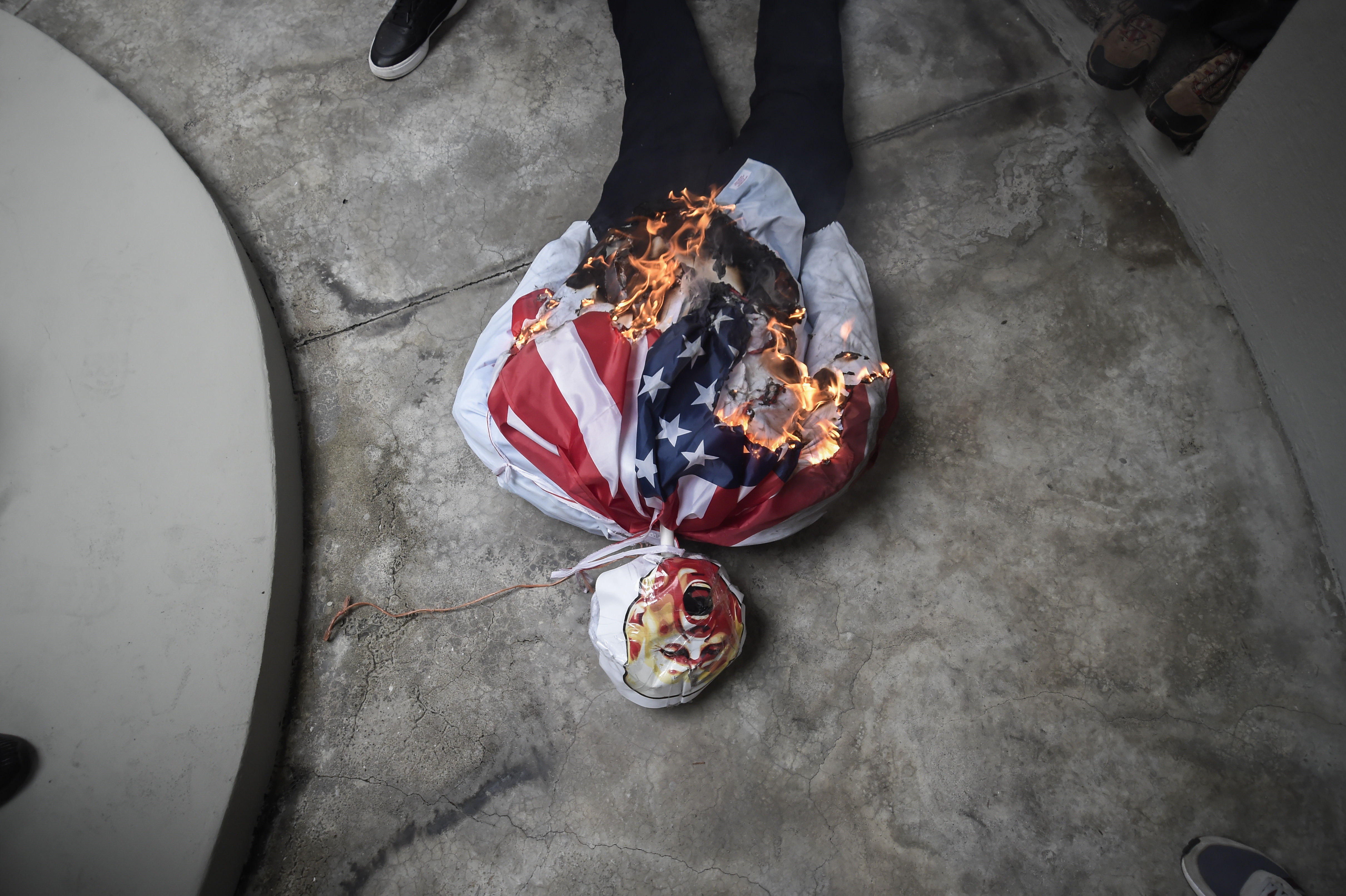 An effigy of President-elect Donald Trump is set on fire during a demonstration marking Martyrs' Day, a national day of mourning to honor the 21 Panamanians who were killed during the January 1964 anti-American riots over sovereignty of the Panama Canal Zone, in Panama City, Thursday, Jan. 9, 2025. (AP Photo/Agustin Herrera)