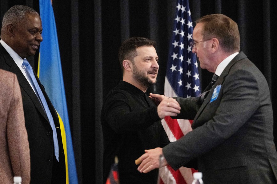 From left: U.S. Secretary of Defense Lloyd Austin, Ukrainian President Volodymyr Zelenskyy and German Defence Minister Boris Pistorius attend a meeting of the Ukraine Contact Group at Ramstein Air Base, Germany, Thursday, Jan. 9, 2025. (Marijan Murat/dpa via AP)