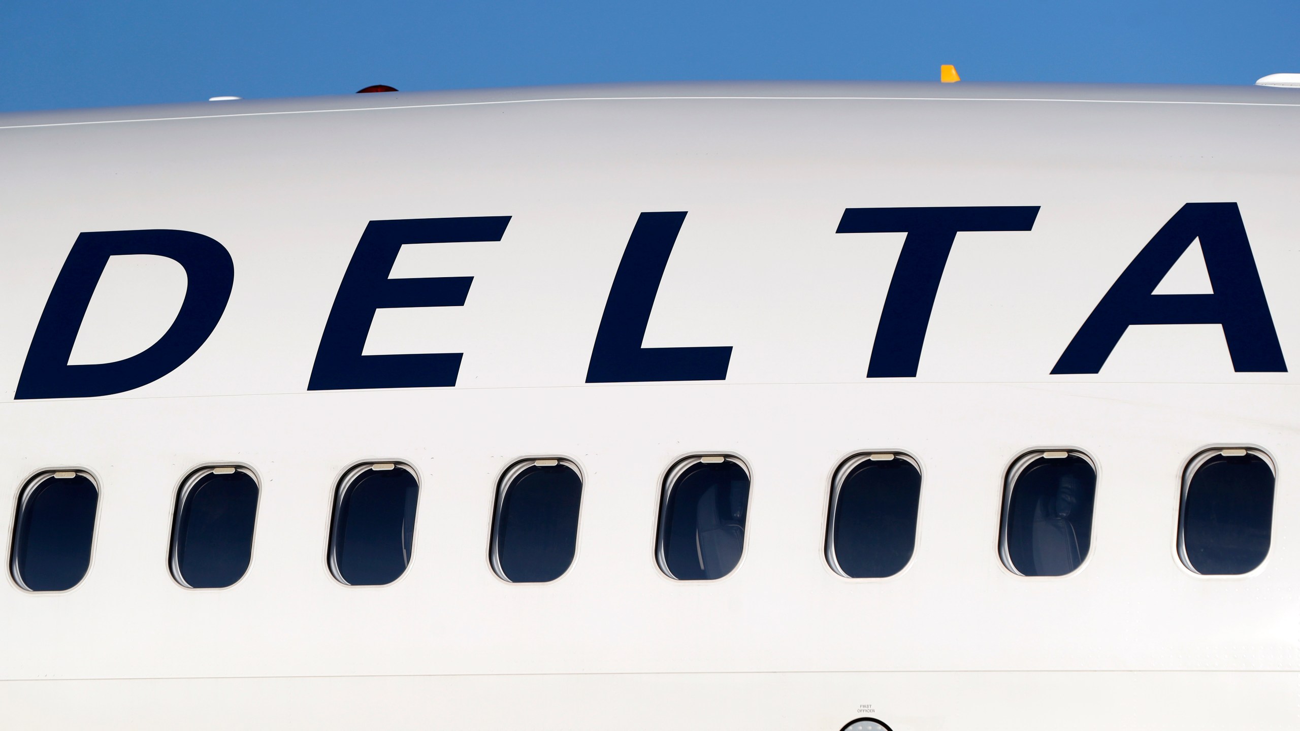 FILE - The company logo graces the side of a Delta Air Lines jetliner at Denver International Airport in Denver, on June 26, 2019. (AP Photo/David Zalubowski, File)