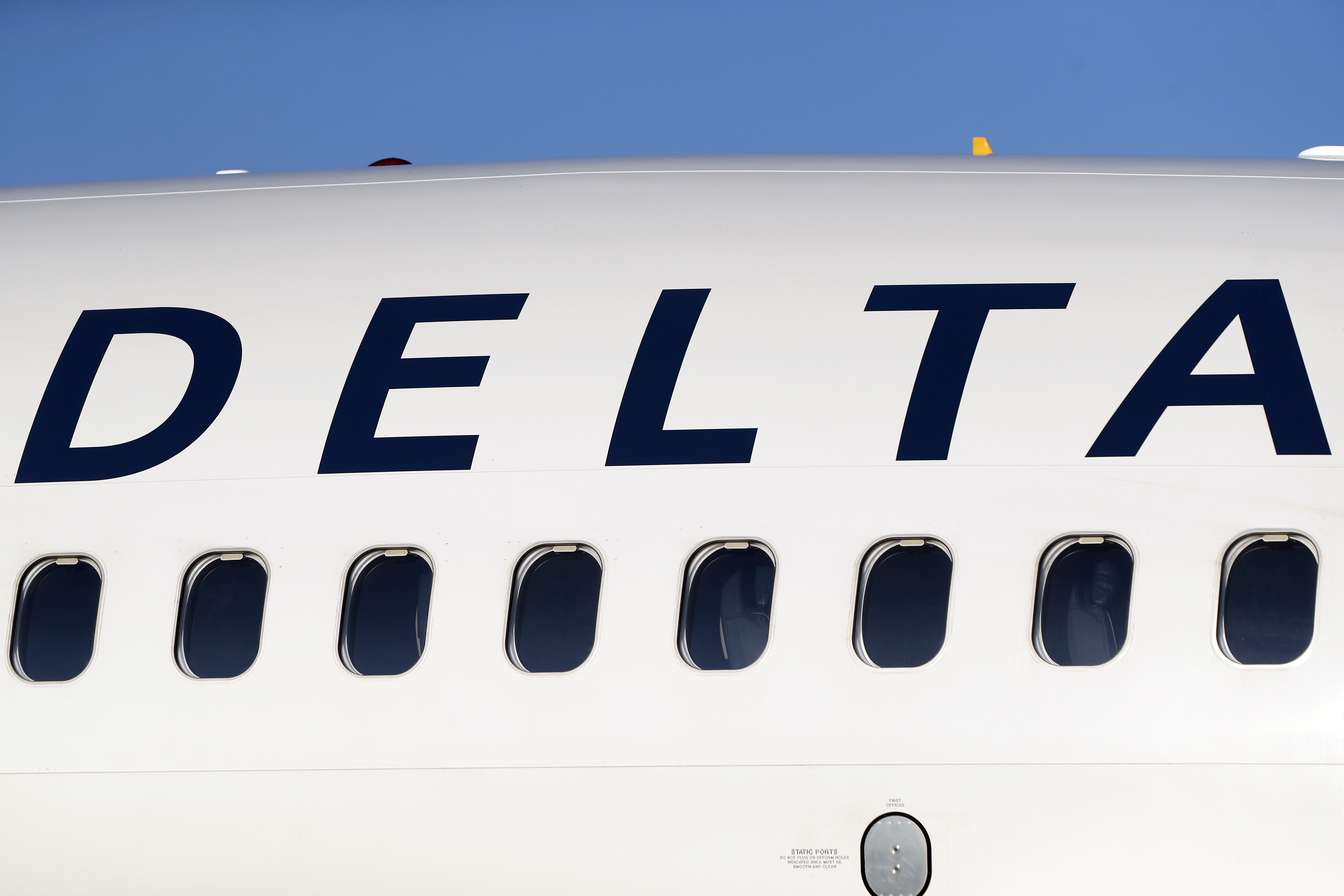 FILE - The company logo graces the side of a Delta Air Lines jetliner at Denver International Airport in Denver, on June 26, 2019. (AP Photo/David Zalubowski, File)