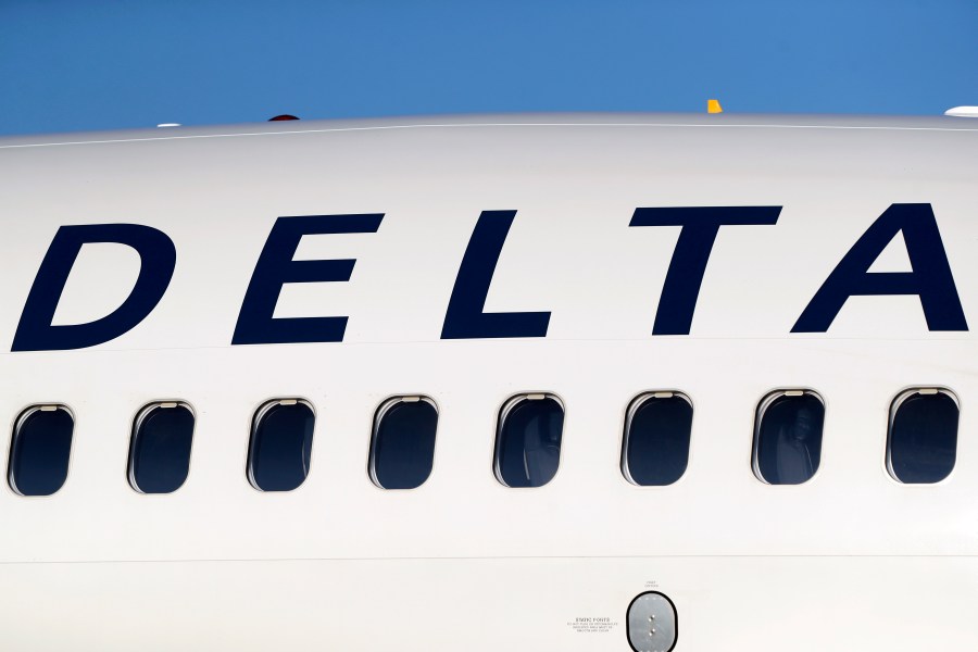 FILE - The company logo graces the side of a Delta Air Lines jetliner at Denver International Airport in Denver, on June 26, 2019. (AP Photo/David Zalubowski, File)