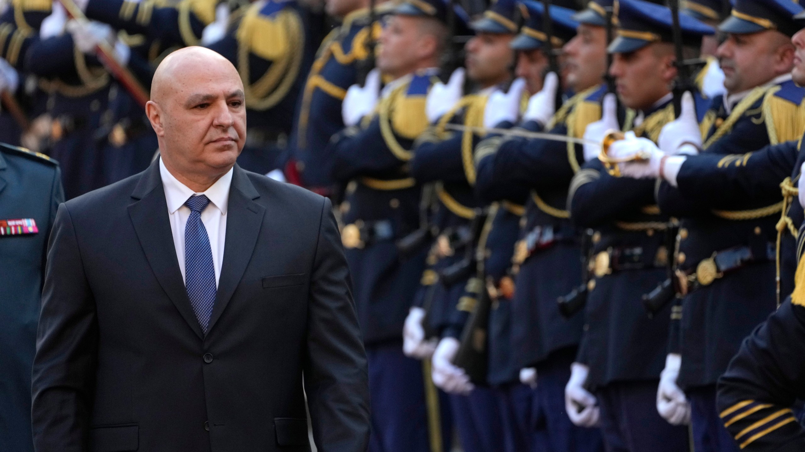 Newly-elected Lebanese President Joseph Aoun reviews the honor guard upon his arrival at the Lebanese Parliament to be sworn in as a new president, in Beirut, Lebanon, Thursday, Jan. 9, 2025. (AP Photo/Hussein Malla)