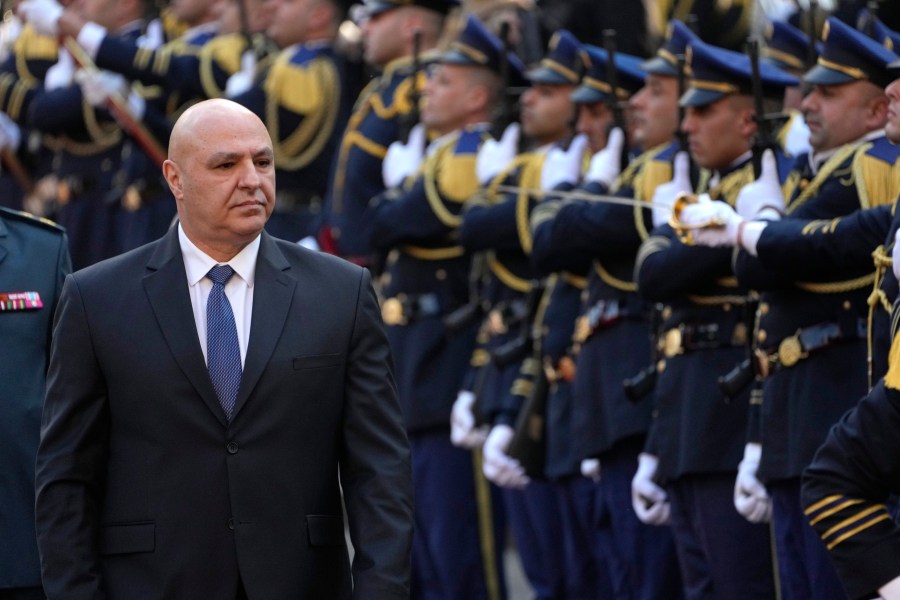 Newly-elected Lebanese President Joseph Aoun reviews the honor guard upon his arrival at the Lebanese Parliament to be sworn in as a new president, in Beirut, Lebanon, Thursday, Jan. 9, 2025. (AP Photo/Hussein Malla)