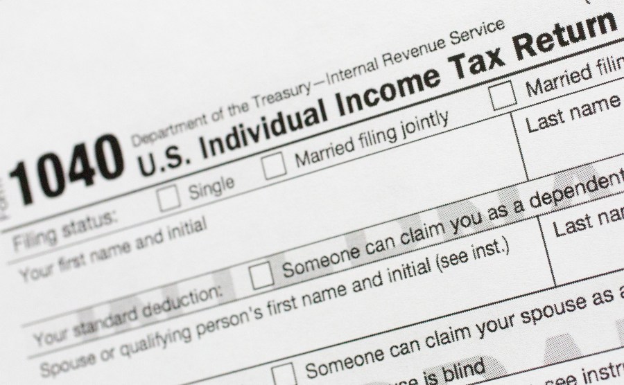 FILE - Part of a 1040 U.S. Individual Income Tax Return form is shown July 24, 2018, in New York. (AP Photo/Mark Lennihan, File)