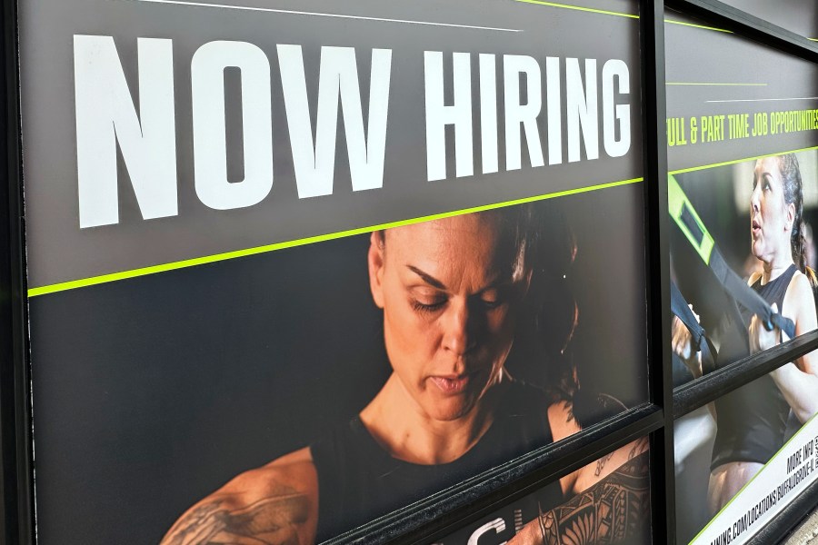 A hiring sign is displayed at a fitness center in Riverwoods, Ill., Sunday, Jan. 5, 2025. (AP Photo/Nam Y. Huh)