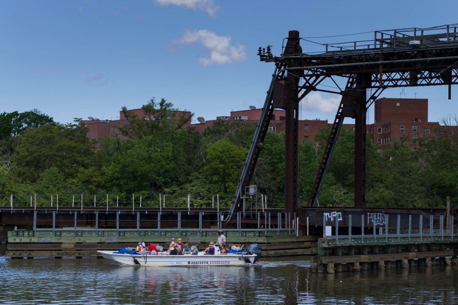 FILE - An Anacostia Riverkeeper boat passes along the river during a tour on May 1, 2024, at Anacostia Park in Washington. (AP Photo/Tom Brenner)