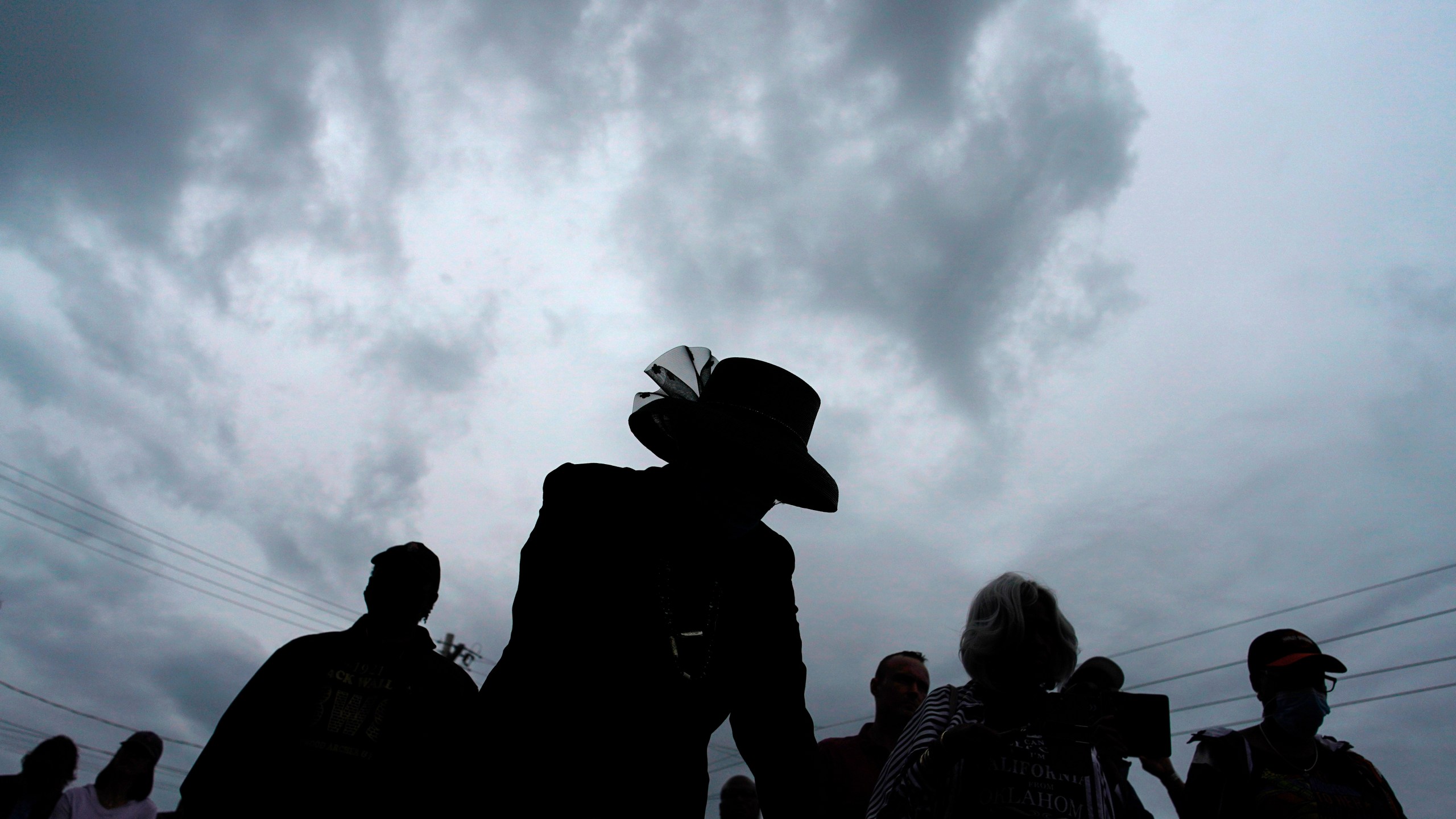 FILE - People attend a dedication of a prayer wall outside of the historic Vernon African Methodist Episcopal Church in the Greenwood neighborhood during the centennial of the Tulsa Race Massacre, in Tulsa, Okla., May 31, 2021. (AP Photo/John Locher, File)