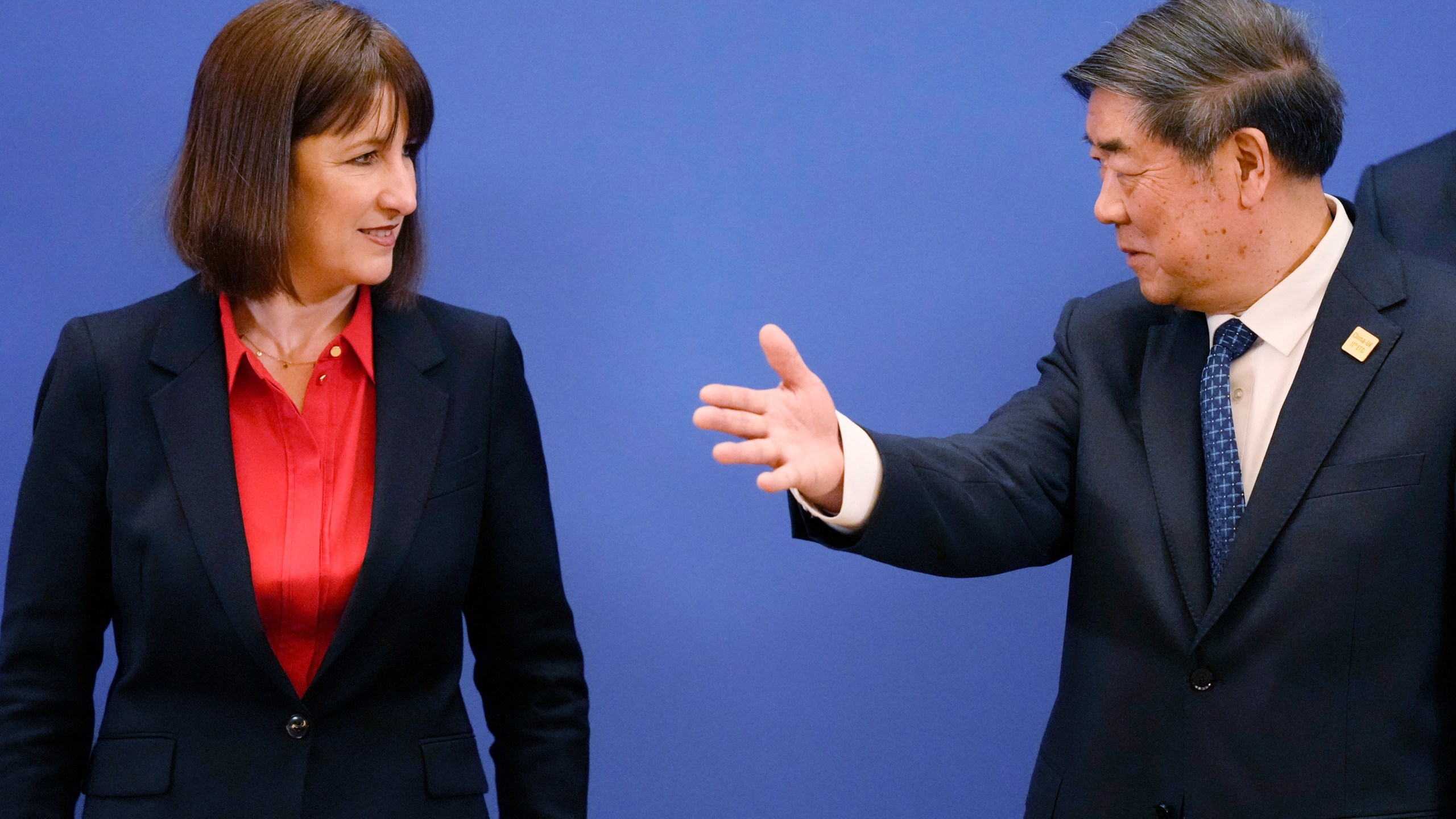 Chinese Vice Premier He Lifeng, right, gestures to Britain's Chancellor of the Exchequer Rachel Reeves and Chinese Vice Premier He Lifeng pose for a group photo before the start of the 11th China - UK Economy and Finance Dialogue in Beijing, Saturday, Jan. 11, 2025. (AP Photo/Aaron Favila, Pool)