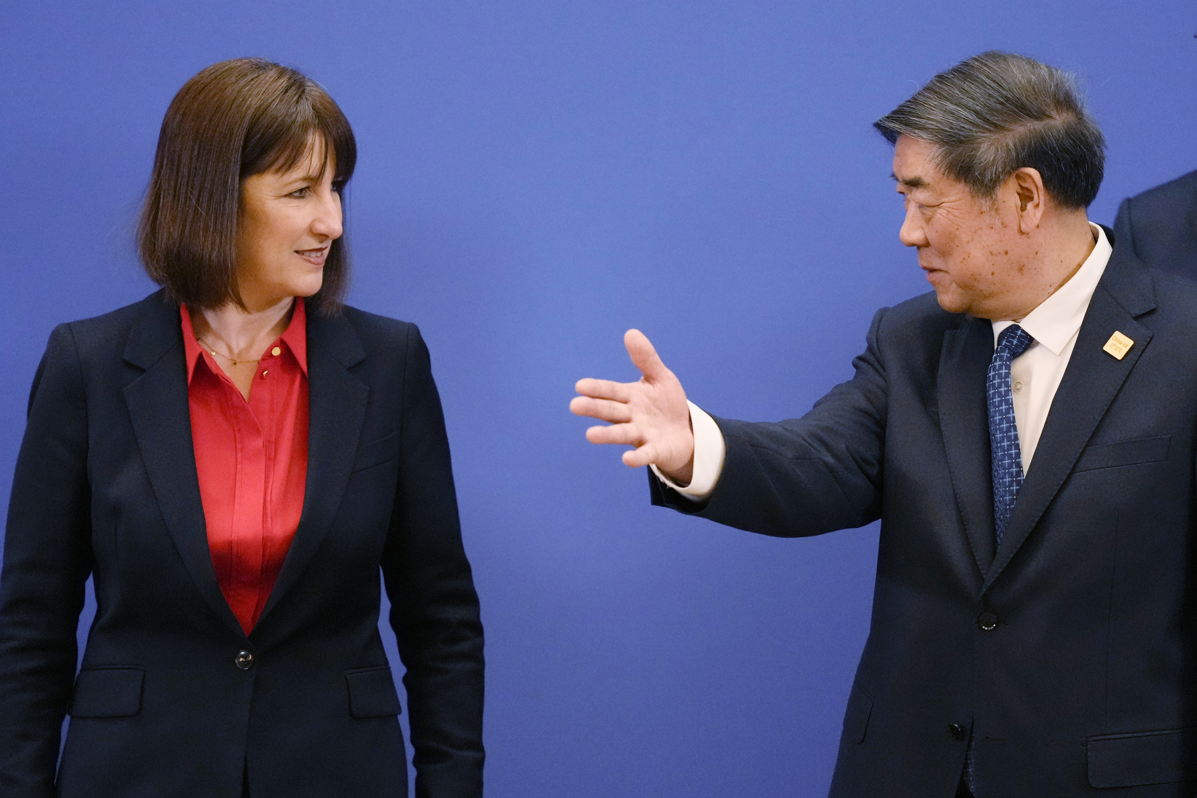 Chinese Vice Premier He Lifeng, right, gestures to Britain's Chancellor of the Exchequer Rachel Reeves and Chinese Vice Premier He Lifeng pose for a group photo before the start of the 11th China - UK Economy and Finance Dialogue in Beijing, Saturday, Jan. 11, 2025. (AP Photo/Aaron Favila, Pool)