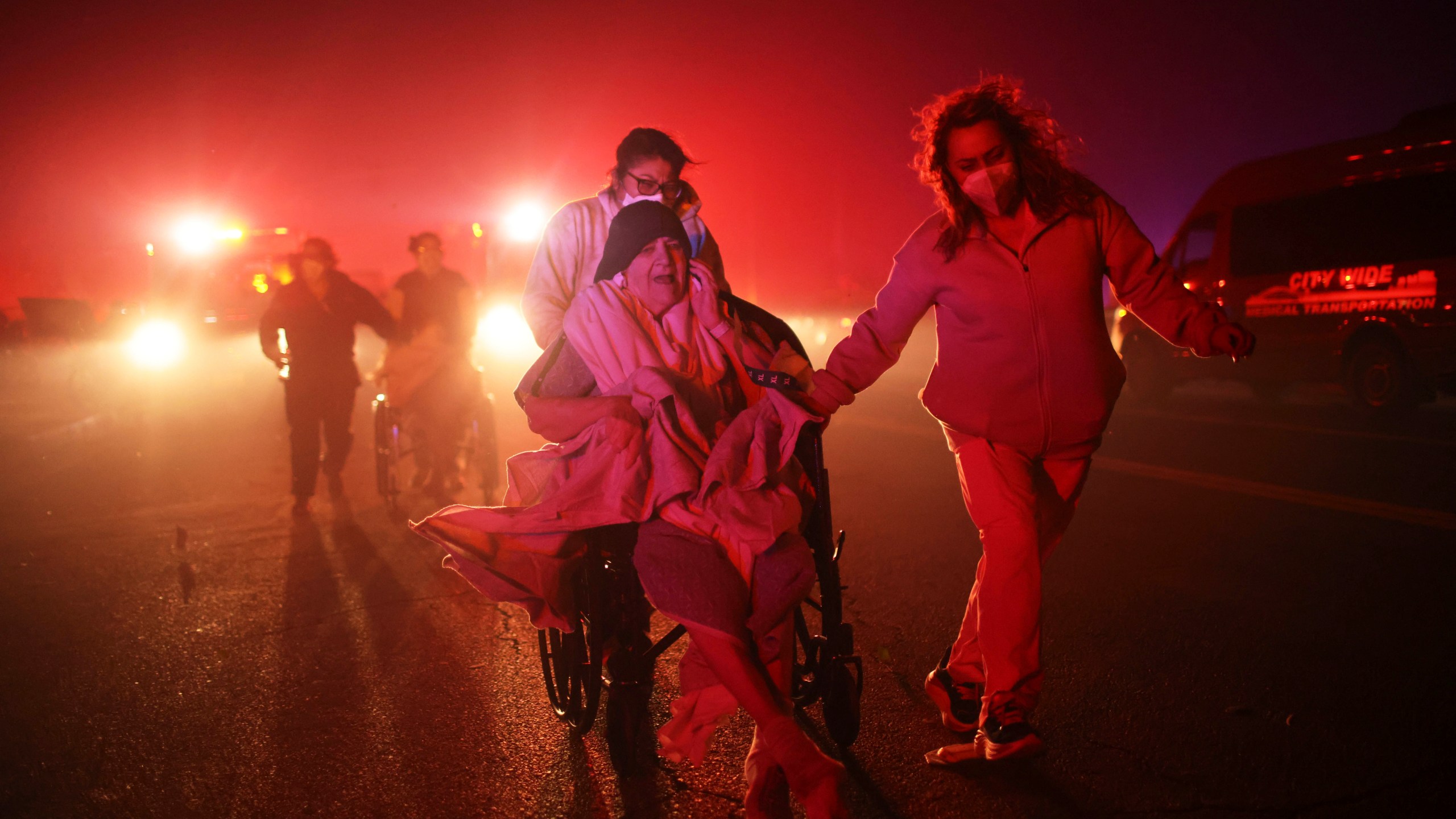 FILE - Residents of a senior center are evacuated as the Eaton Fire approaches Jan. 7, 2025, in Altadena, Calif. (AP Photo/Ethan Swope, File)