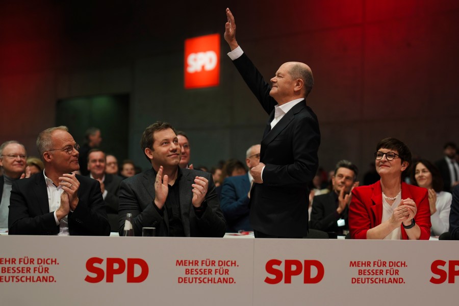 German Chancellor Olaf Scholz waves as he arrives at a special party convention of the Social Democratic Party, SPD, in Berlin, Germany, Saturday, Jan. 11, 2025. (AP Photo/Markus Schreiber)