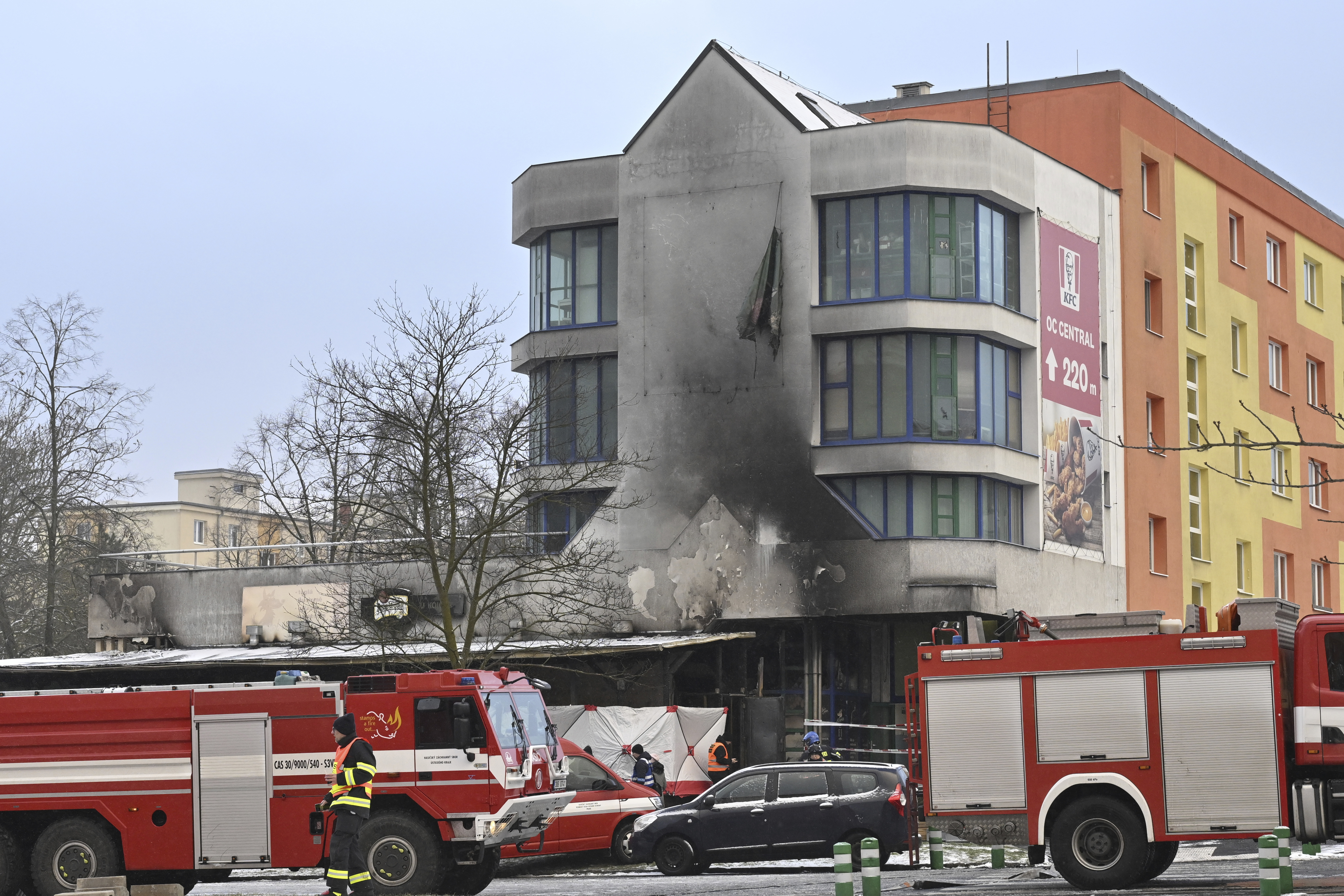 Emergency services attend the scene of a fire at a restaurant in Most, Czech Republic, Sunday Jan. 12, 2025. (Ondrej Hajek/CTK via AP)