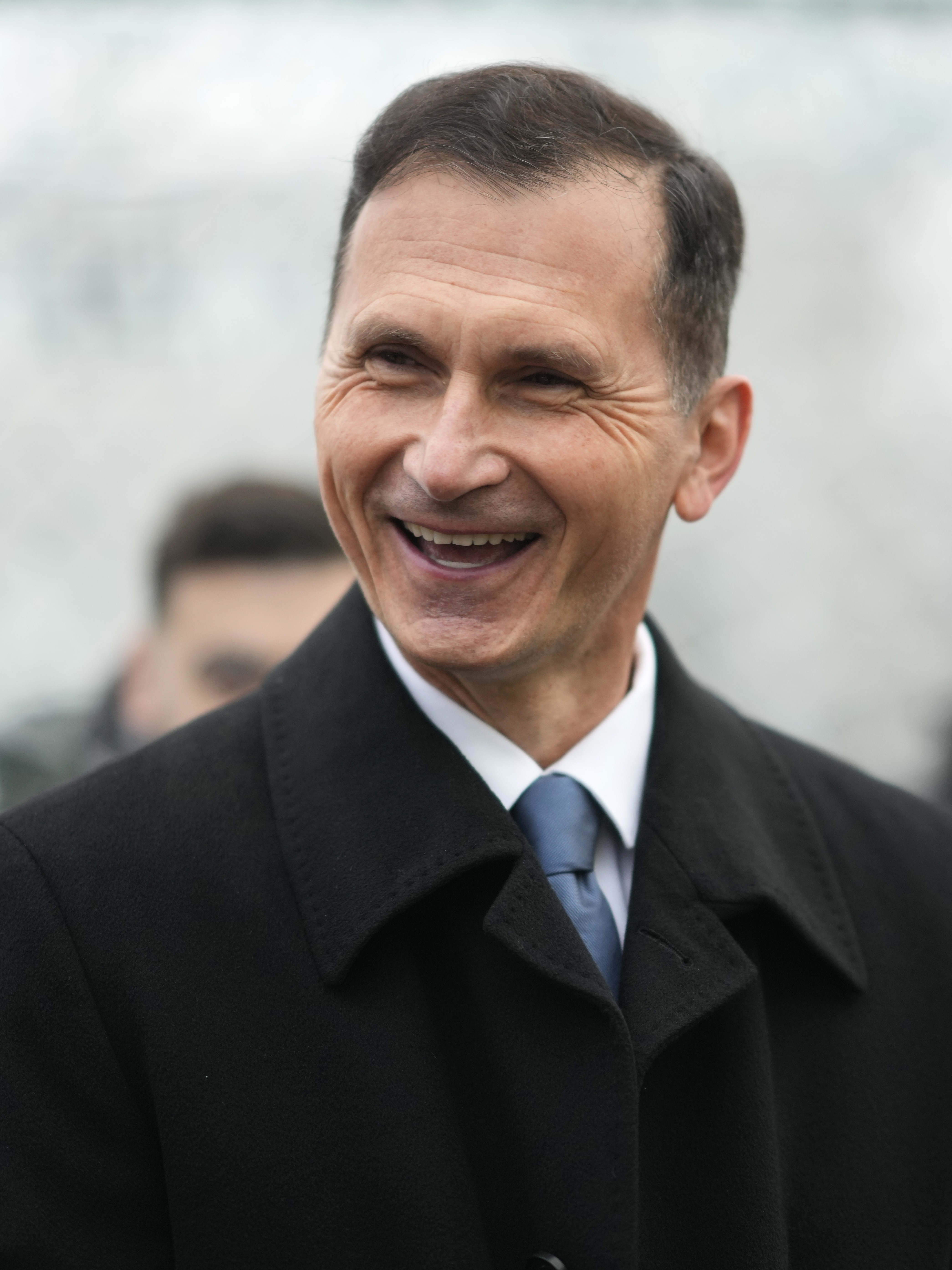 Presidential candidate Dragan Primorac talks to media during a runoff vote for the Croatian presidential election at a polling station in Zagreb, Croatia, Sunday, Jan. 12, 2025. (AP Photo/Darko Bandic)