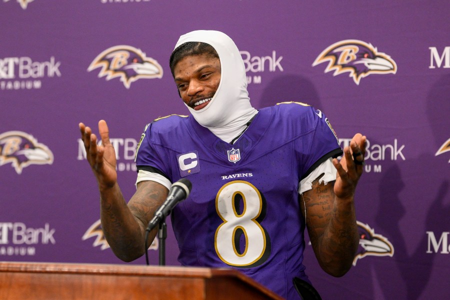 Baltimore Ravens quarterback Lamar Jackson talks to reporters following an NFL wild-card playoff football game against the Pittsburgh Steelers, Saturday, Jan. 11, 2025, in Baltimore. The Ravens won 28-14. (AP Photo/Nick Wass)