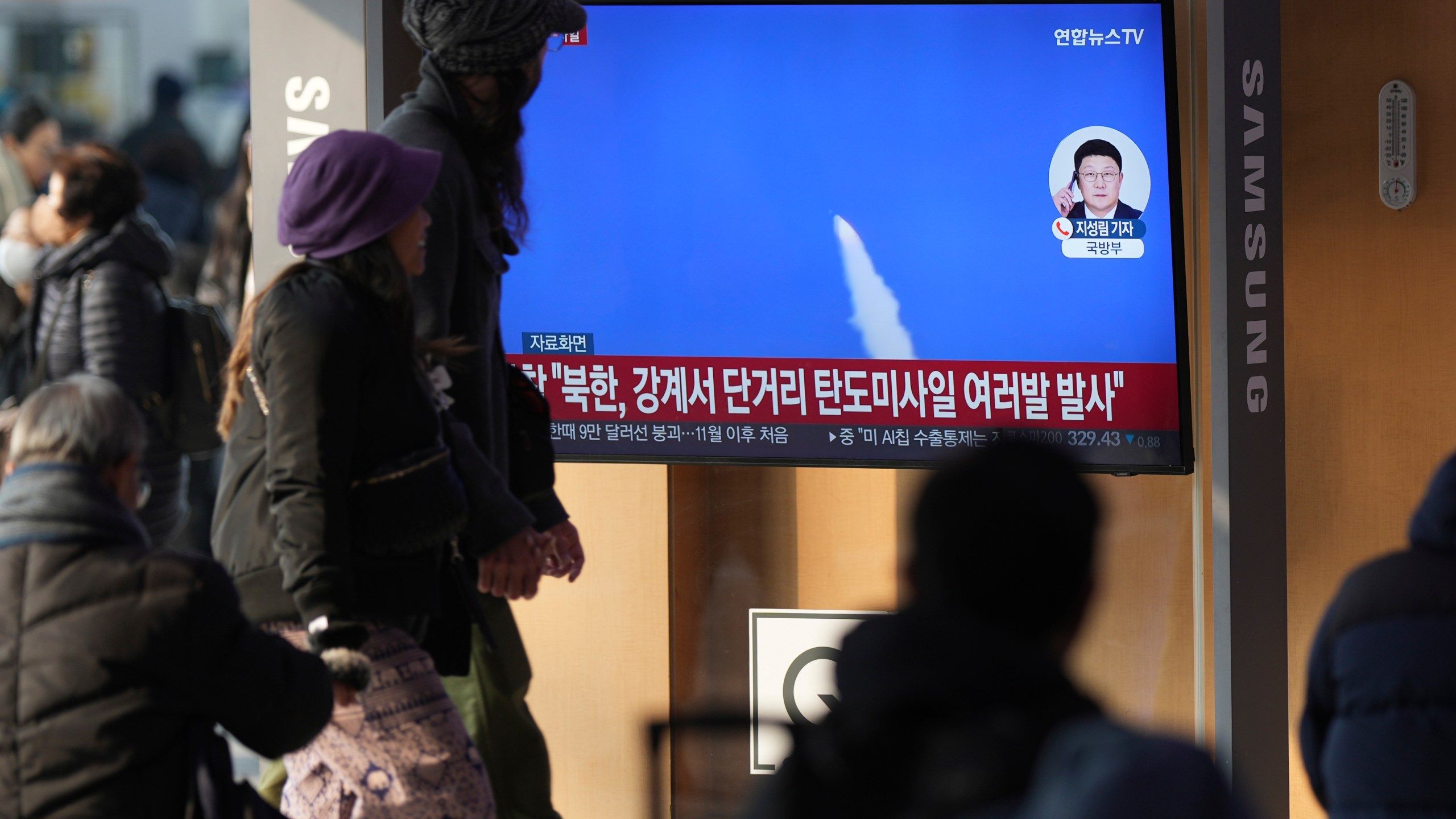 A TV screen shows a report of North Korea's missiles launch with file footage during a news program at the Seoul Railway Station in Seoul, South Korea, Tuesday, Jan. 14, 2025. (AP Photo/Lee Jin-man)