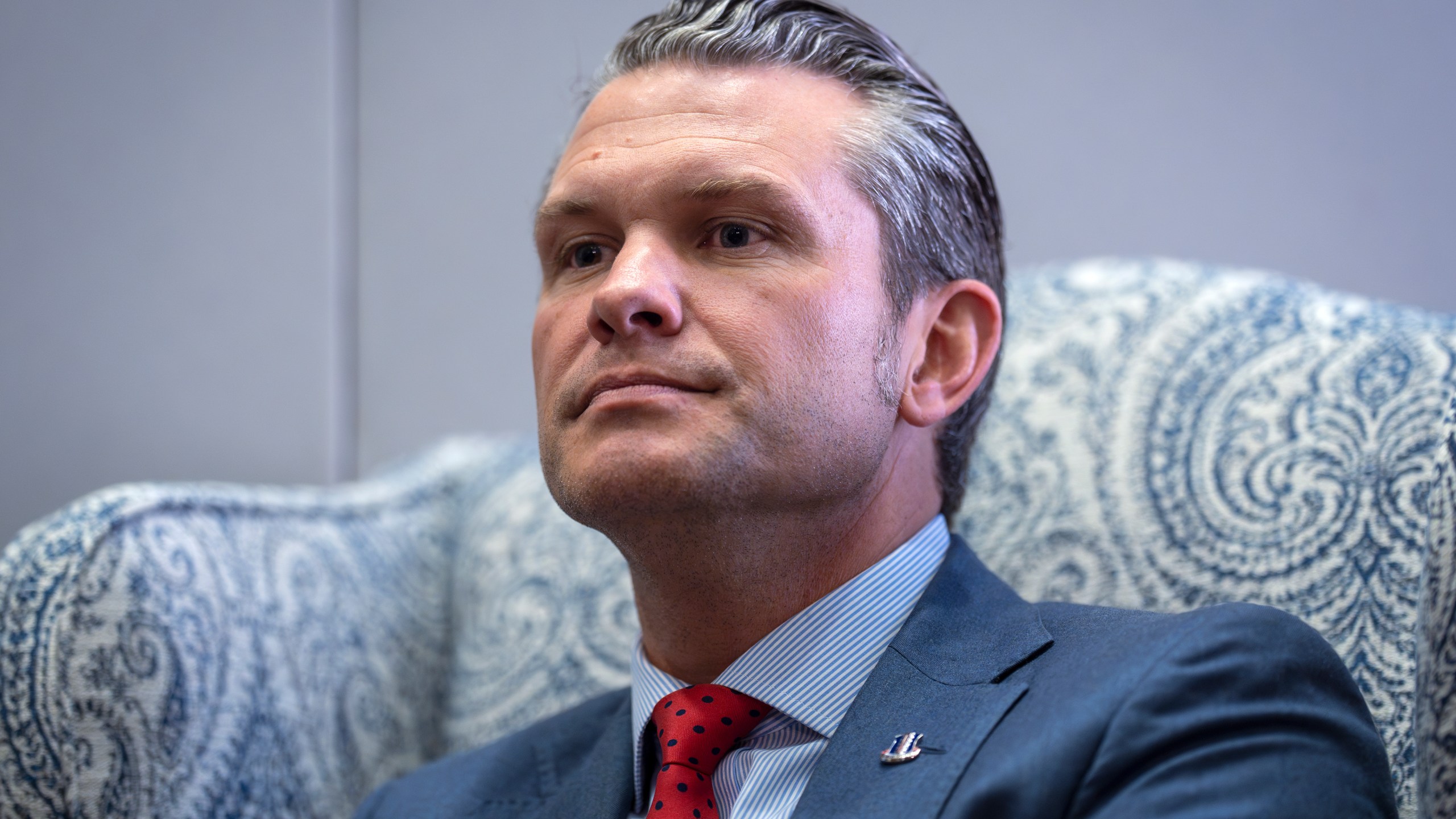 FILE - Pete Hegseth, President-elect Donald Trump's nominee to be defense secretary, responds to reporters during a meeting with Sen. Mike Rounds, R-S.D., a member of the Senate Armed Services Committee, at the Capitol in Washington, Dec. 5, 2024. (AP Photo/J. Scott Applewhite, File)