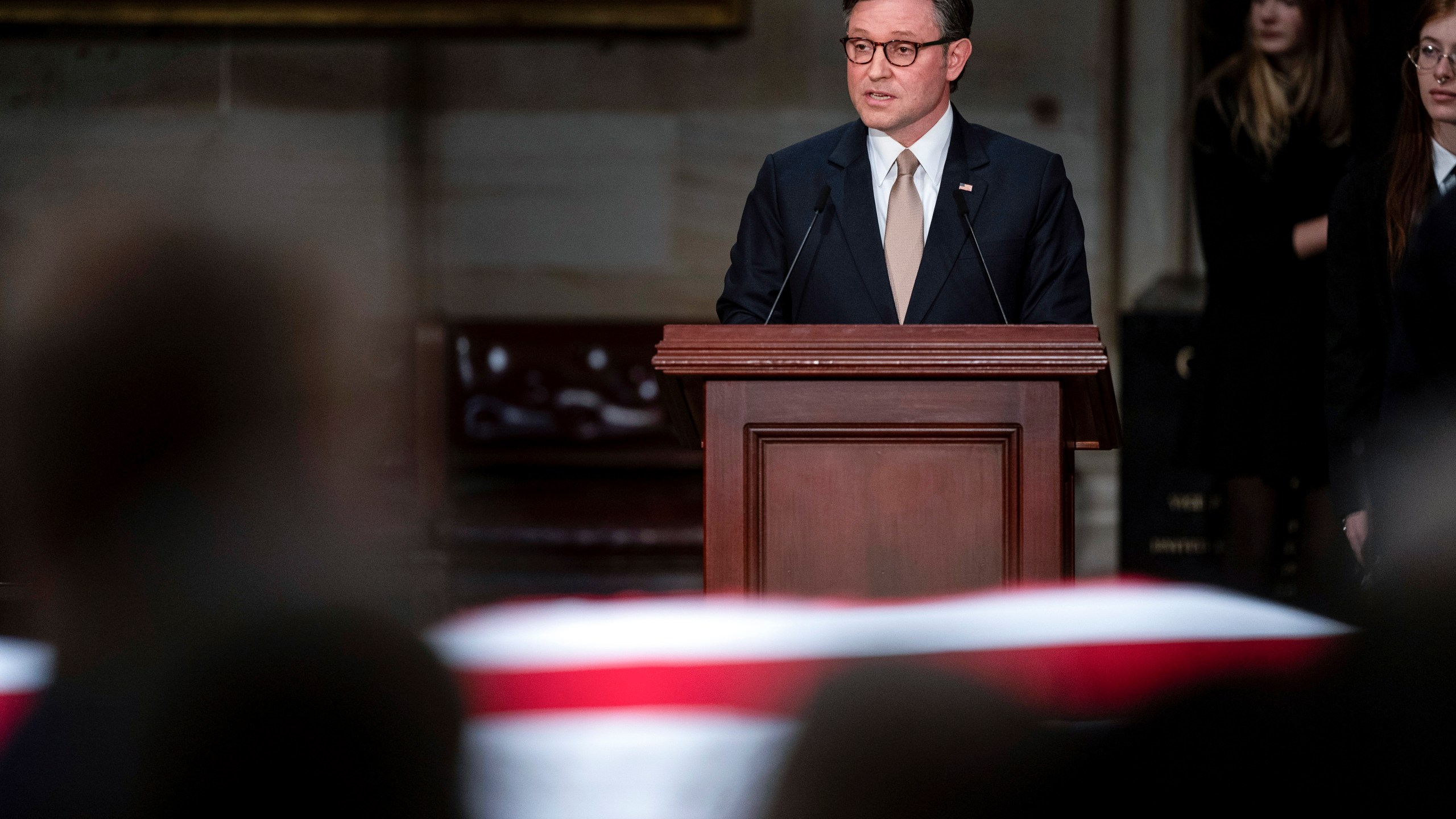 Speaker of the House Mike Johnson of Louisiana, speaks during a ceremony as the flag-draped casket of former President Jimmy Carter lies in state, at the Capitol, Tuesday, Jan. 7, 2025, in Washington. Carter died Dec. 29 at the age of 100. (Kent Nishimura/The New York Times via AP, Pool)